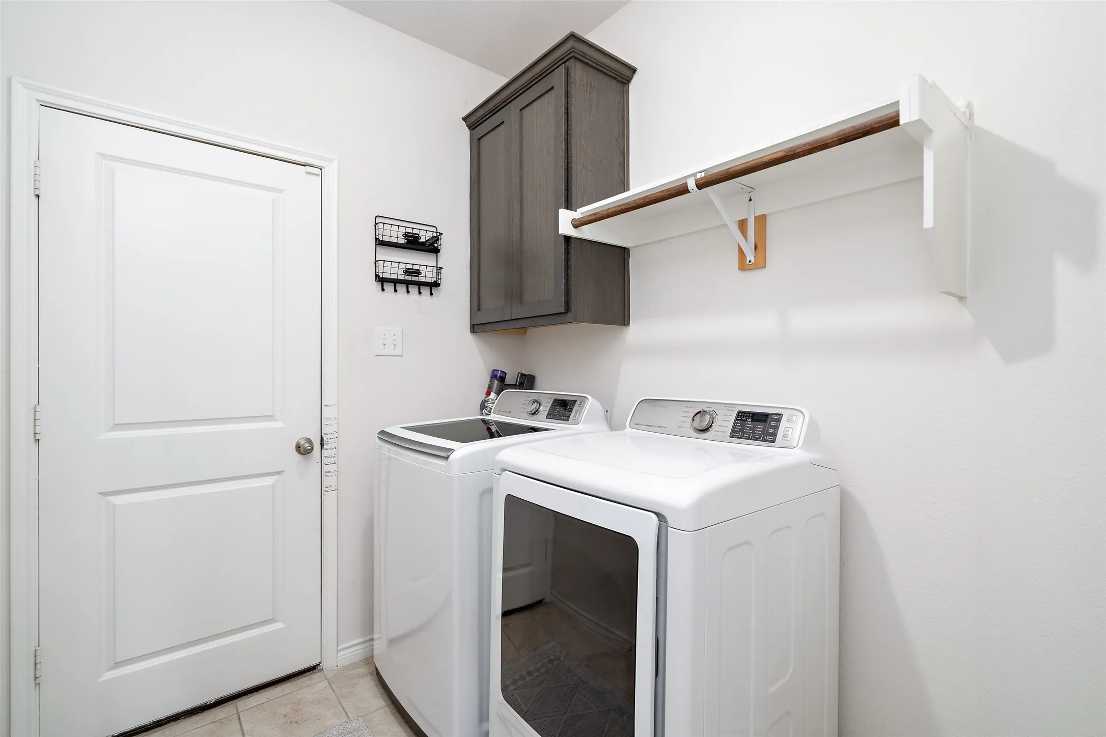Utility Room with Storage and hanging area!