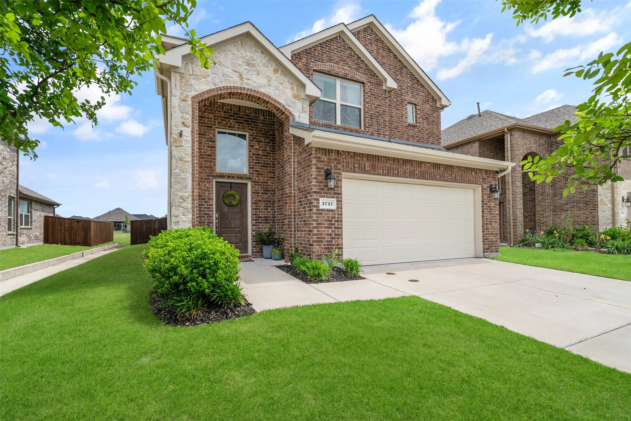 4 Bedroom Home on a Greenbelt Lot with 2026 NEW Roof, Gutters, Some Windows, and Stone accent elevation. Epoxy Garage Floors.