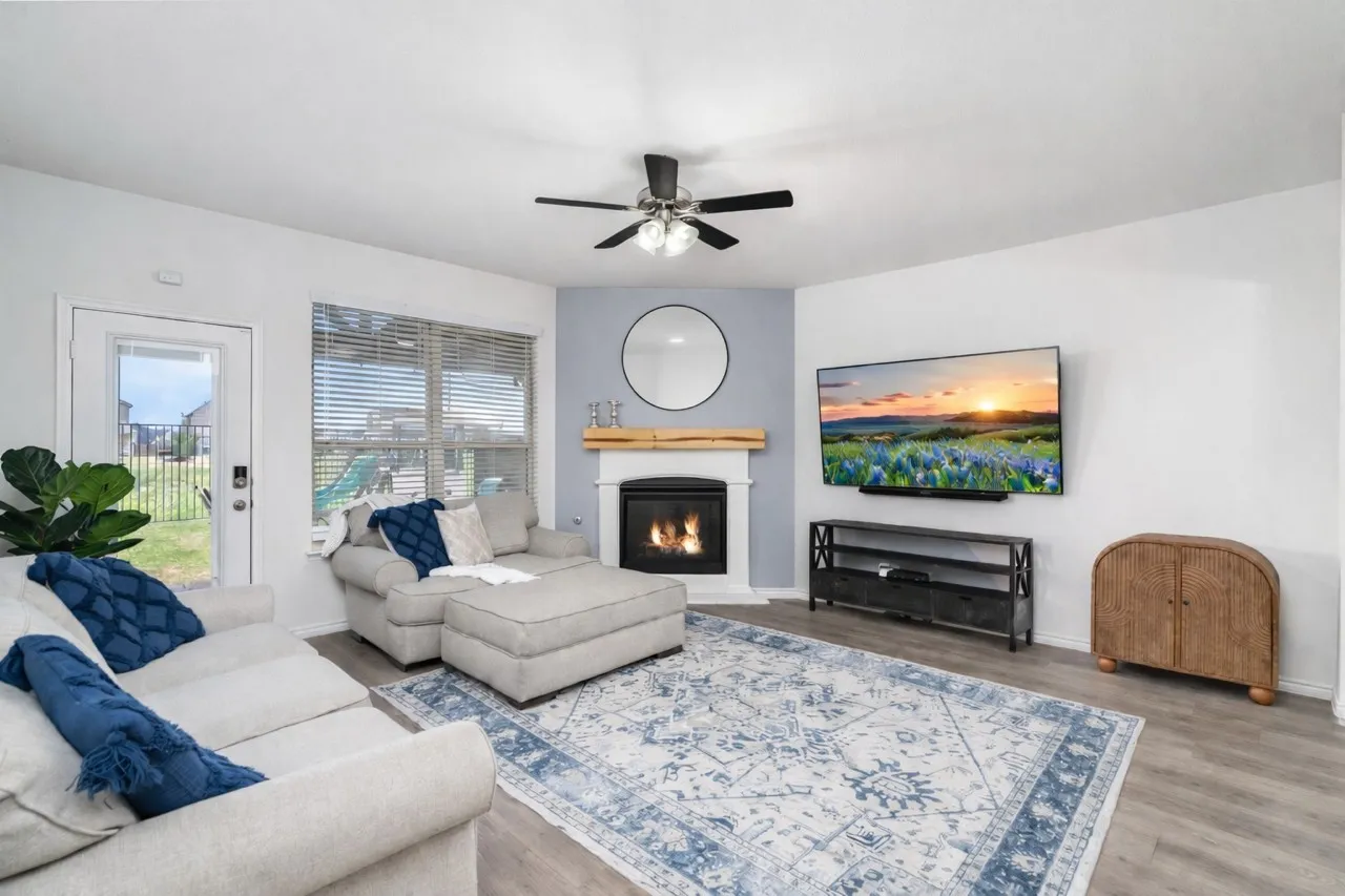 Enjoy the view from this living area toward Greenbelt and your custom covered patio.