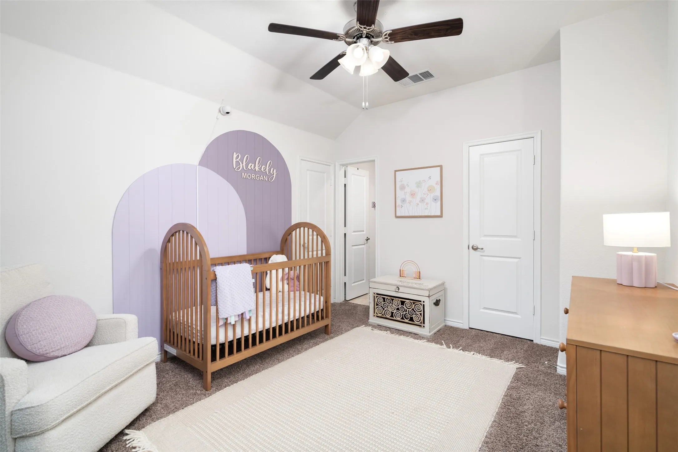Upstairs secondary bedroom with cozy sitting area, ensuite bathroom, generous closet.