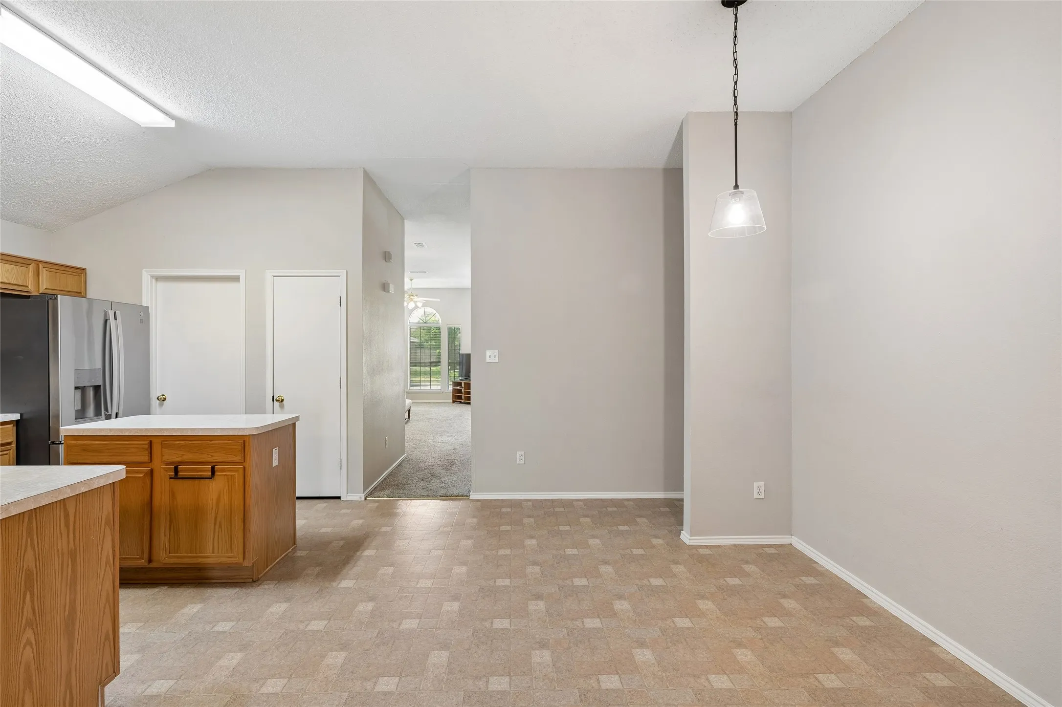 The flooring in the kitchen has vinyl flooring.