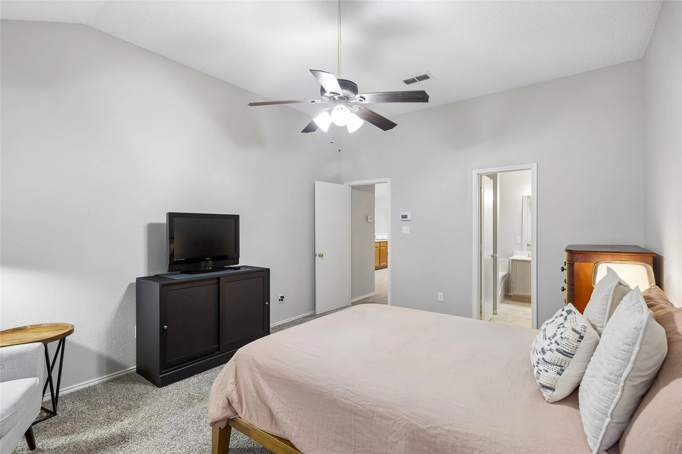 Another view of the Primary bedroom looking toward the private bathroom.