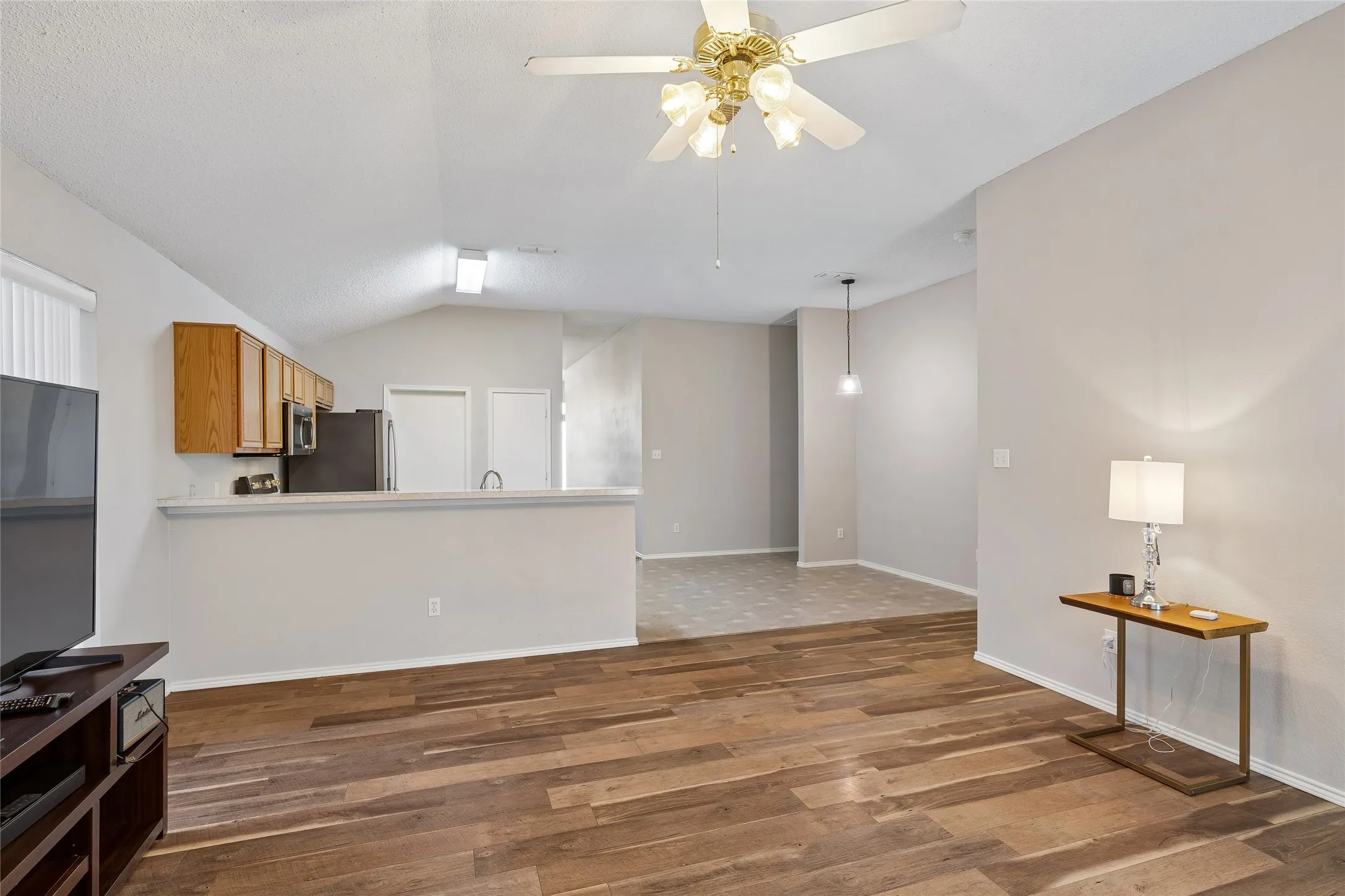 The kitchen opens to the Den area.