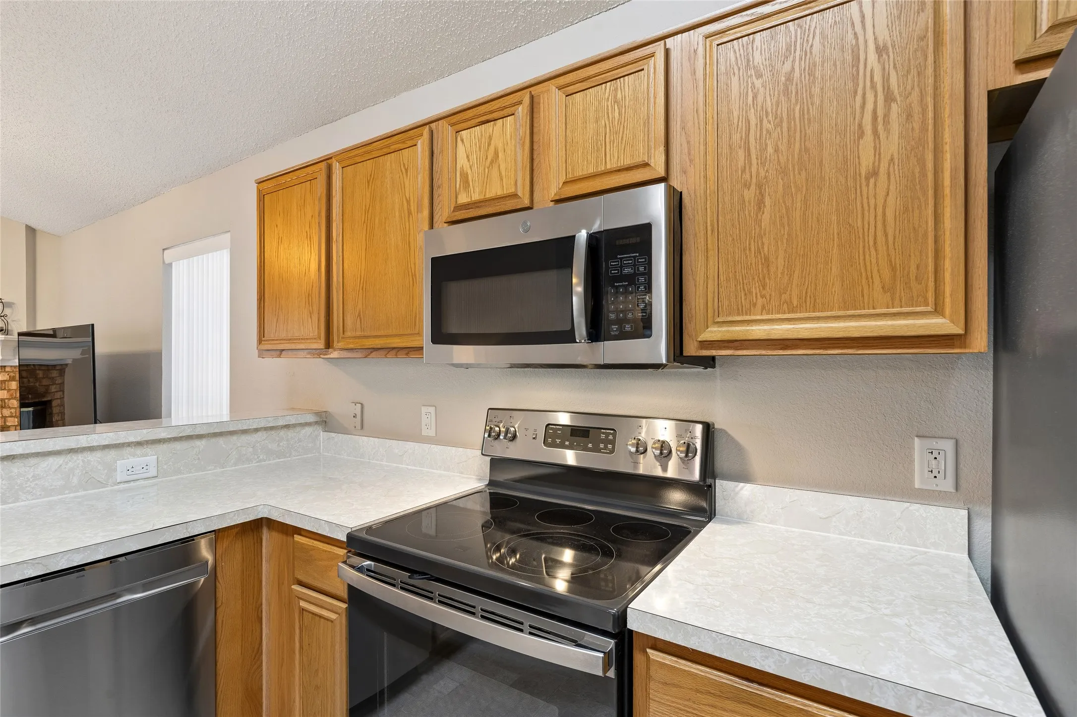 Nice counter tops, slick top range + microwave.