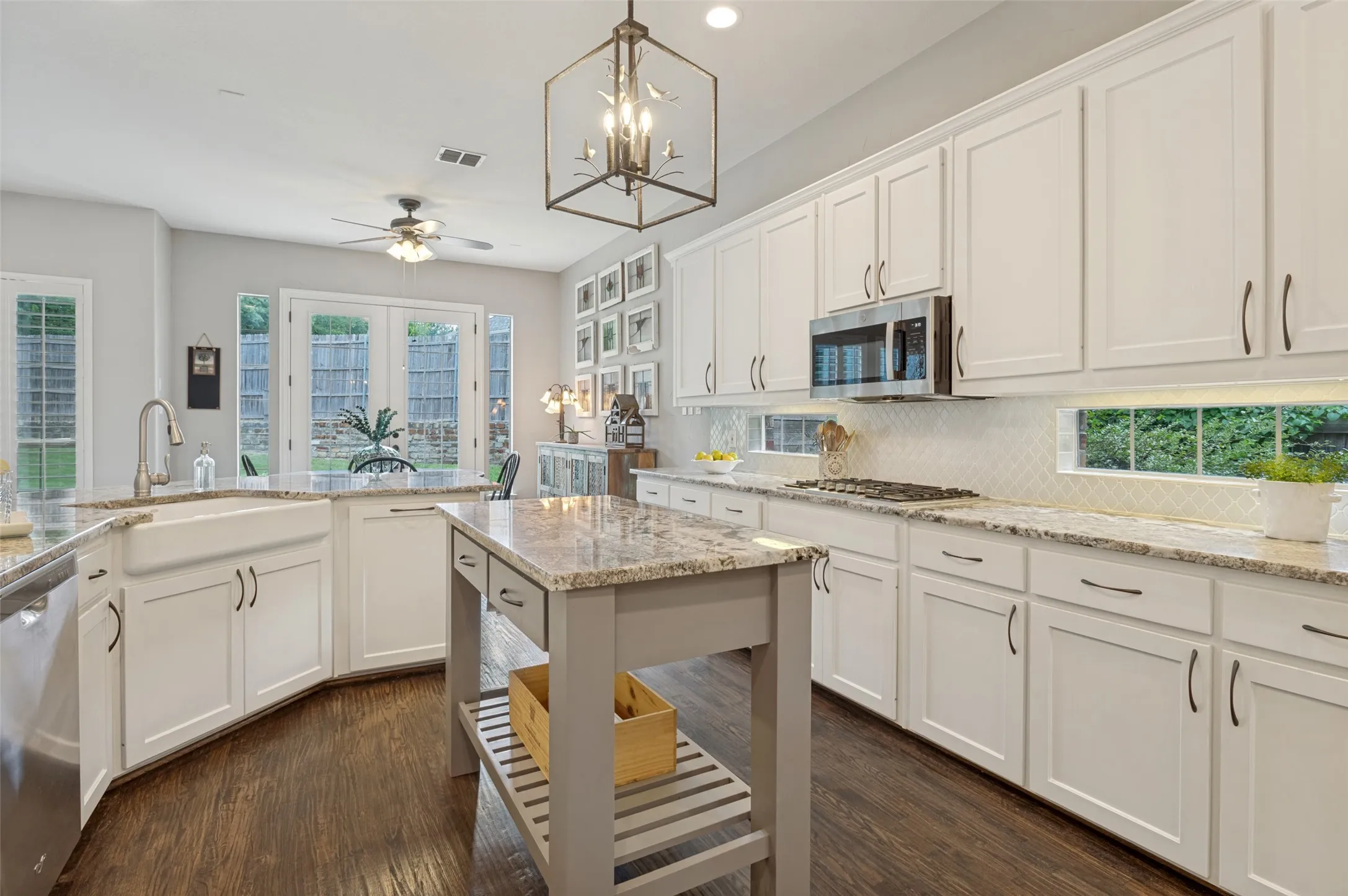 Gorgeous updated kitchen  Farm sink, gas cooktop, double ovens new counters and backsplash
