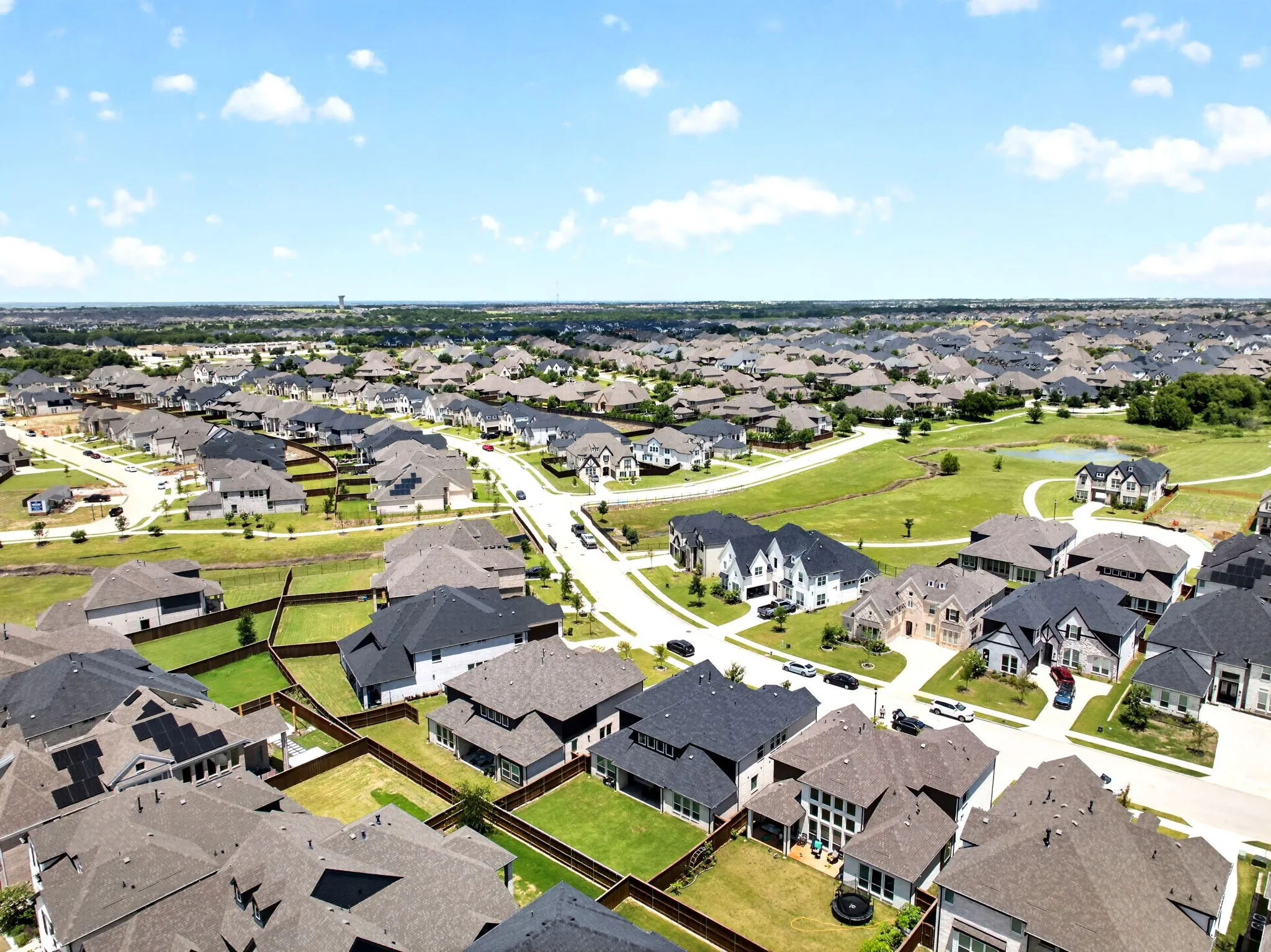 Aerial perspective showcasing a residential community with numerous single-family homes