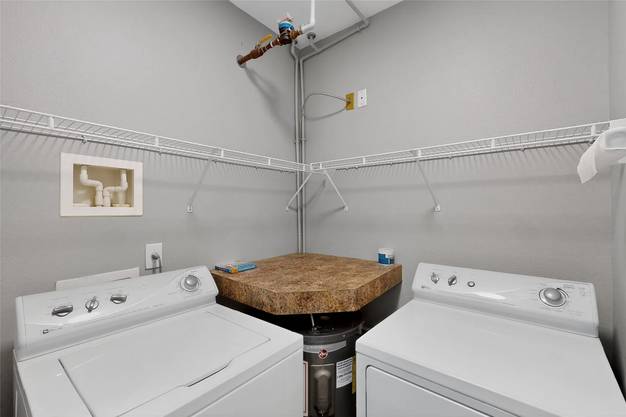 Washroom featuring independent washer and dryer