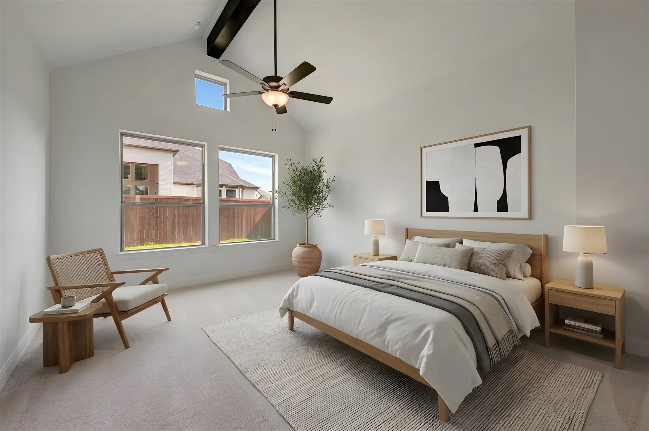 Vaulted ceiling with exposed beams, ceiling fan, and high windows