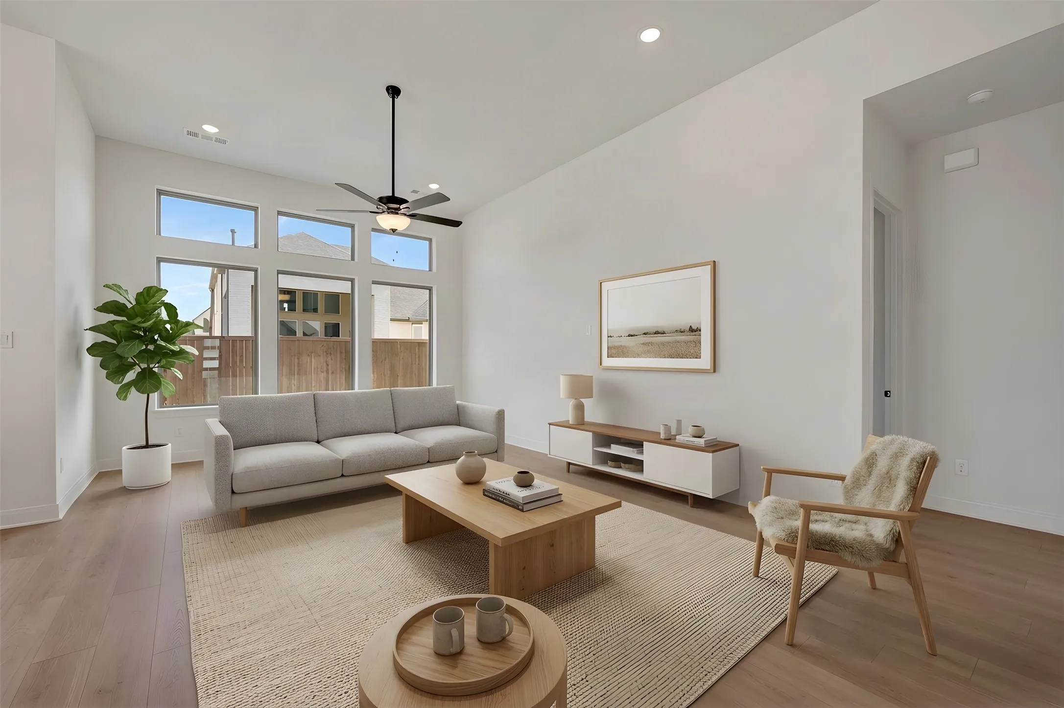 Vaulted ceiling featuring a ceiling fan, recessed lighting, and wood-finish flooring