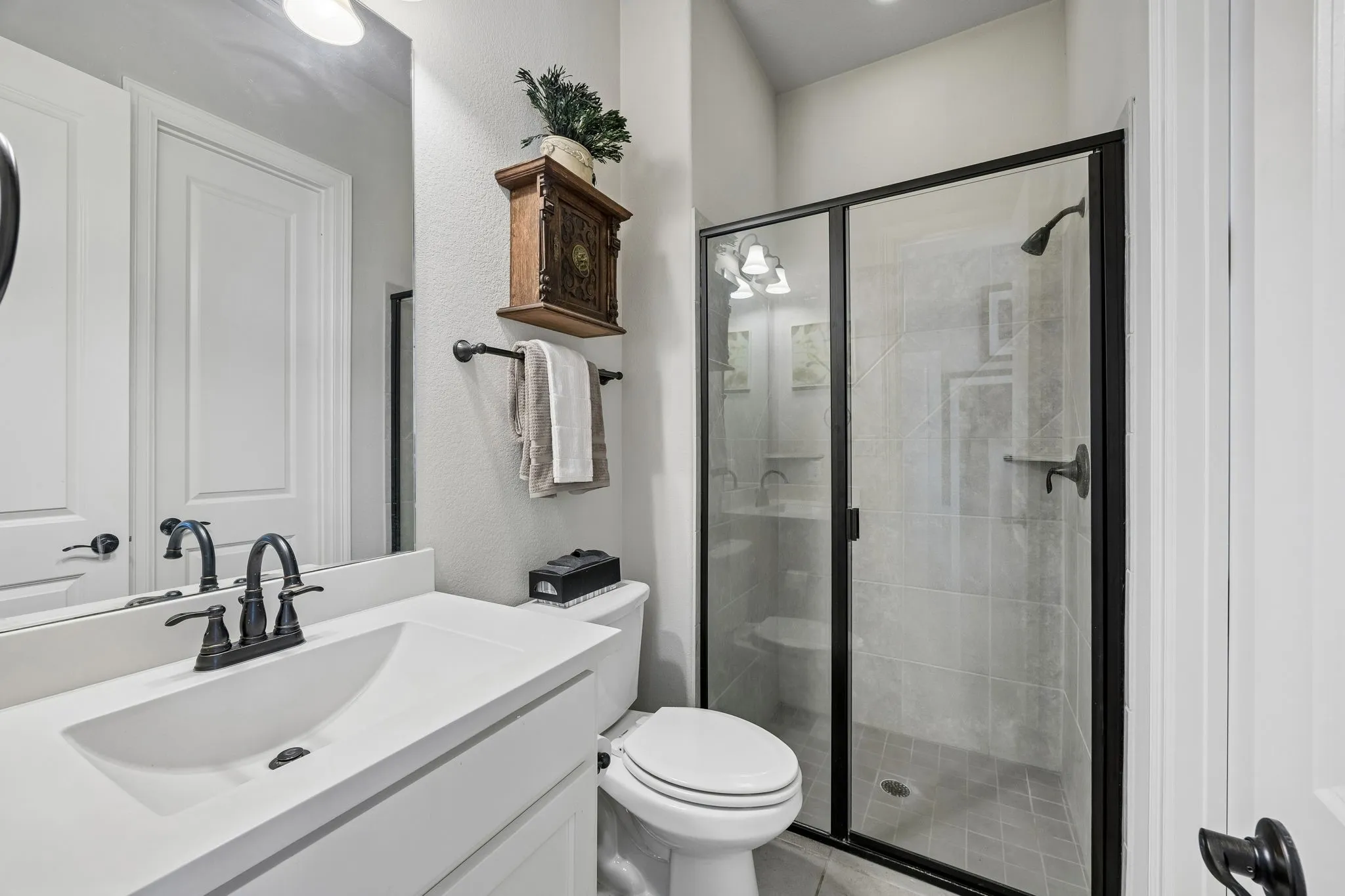 Ensuite bath to guest bedroom with shower and walk-in closet.