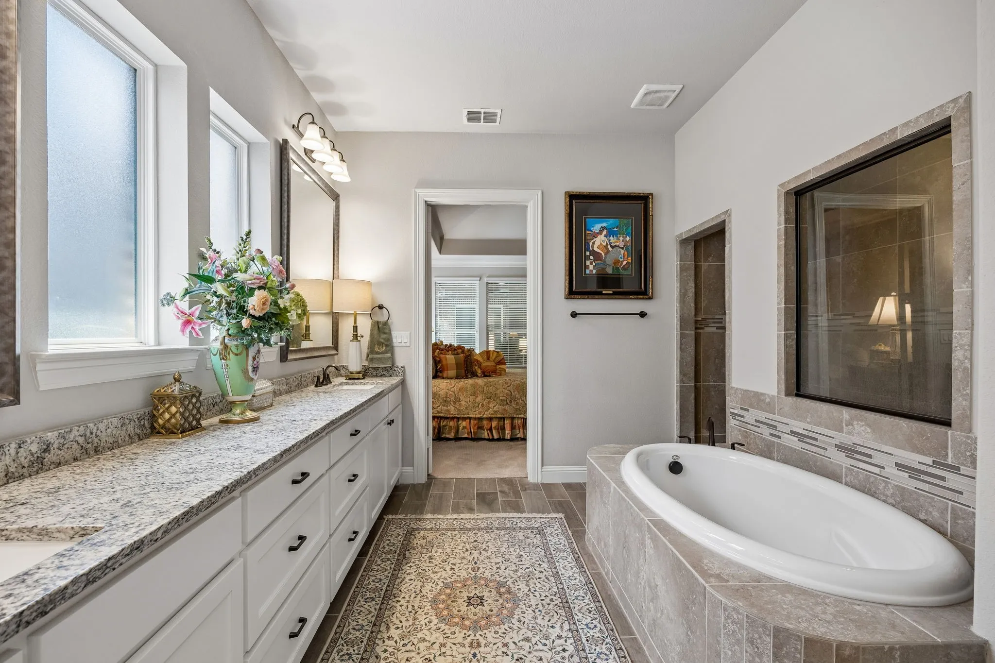 Separate soaking tub and walk-in shower adds to this elegant primary bath.