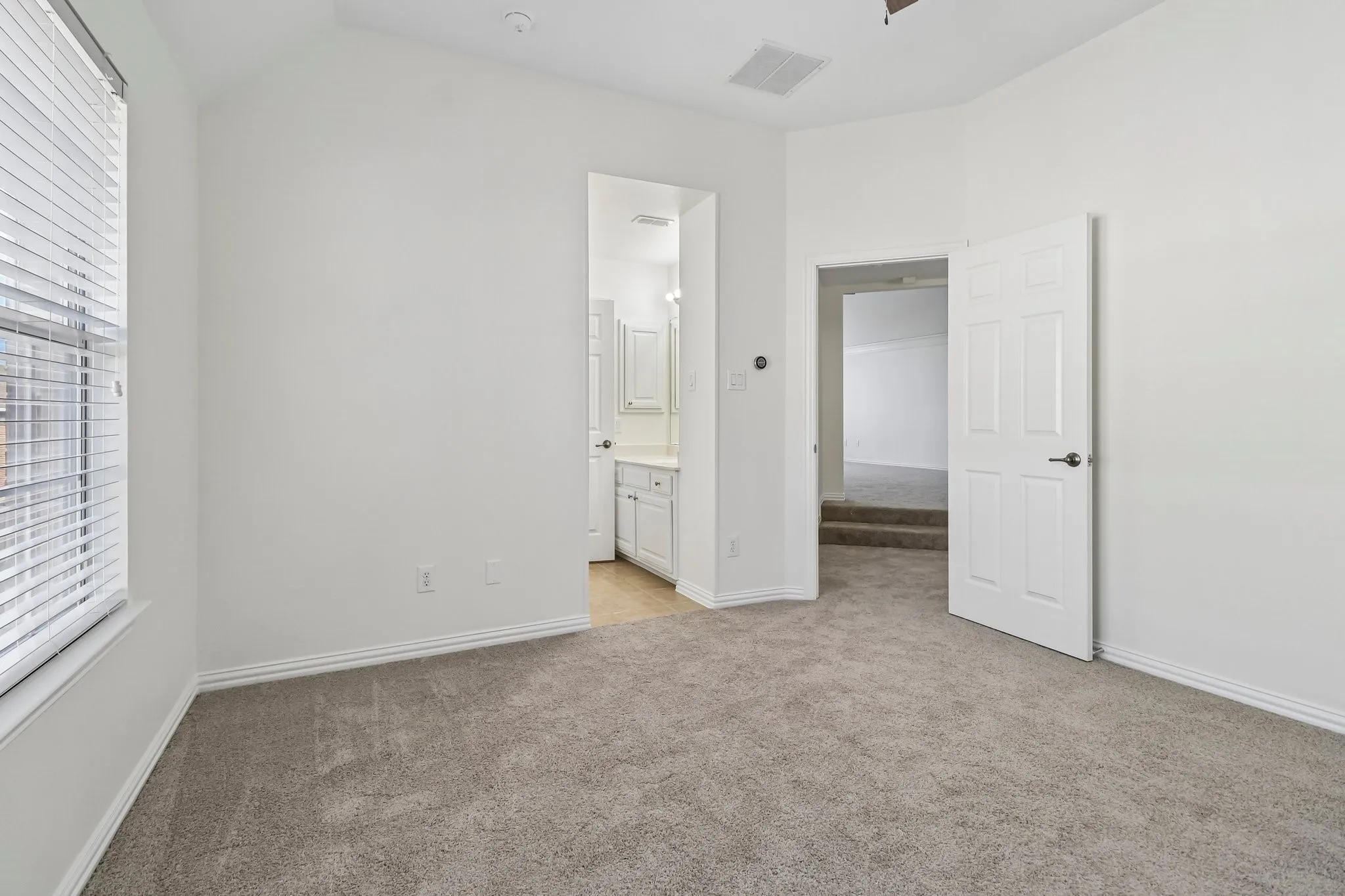 Upstairs bedroom with LED ceiling fan.
