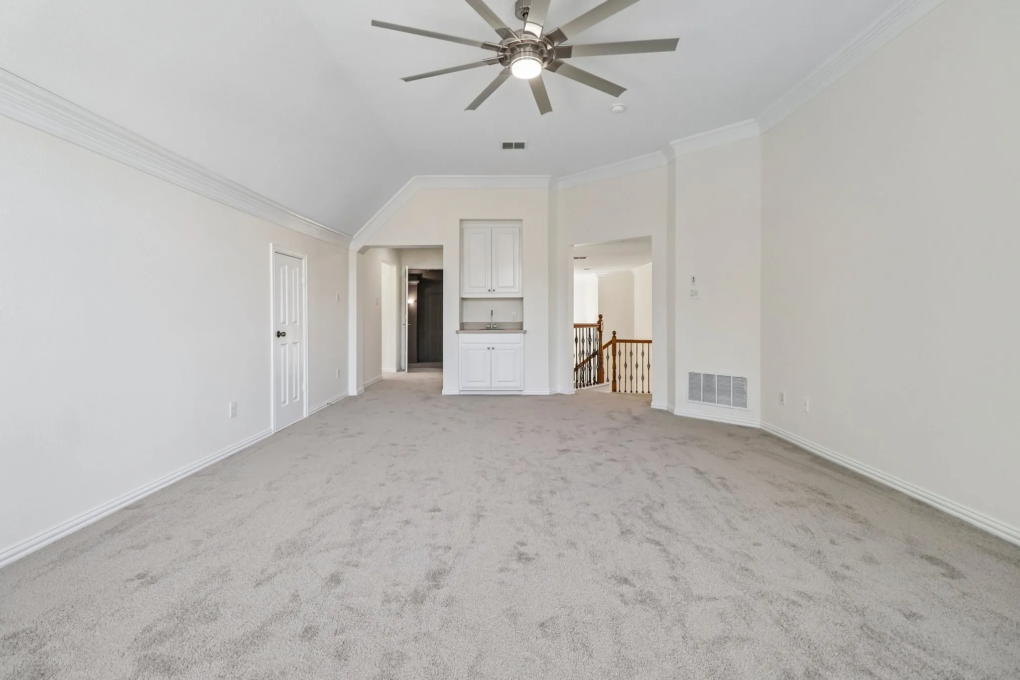 Game room also features a wet bar, 72' ceiling fan and attic storage access.