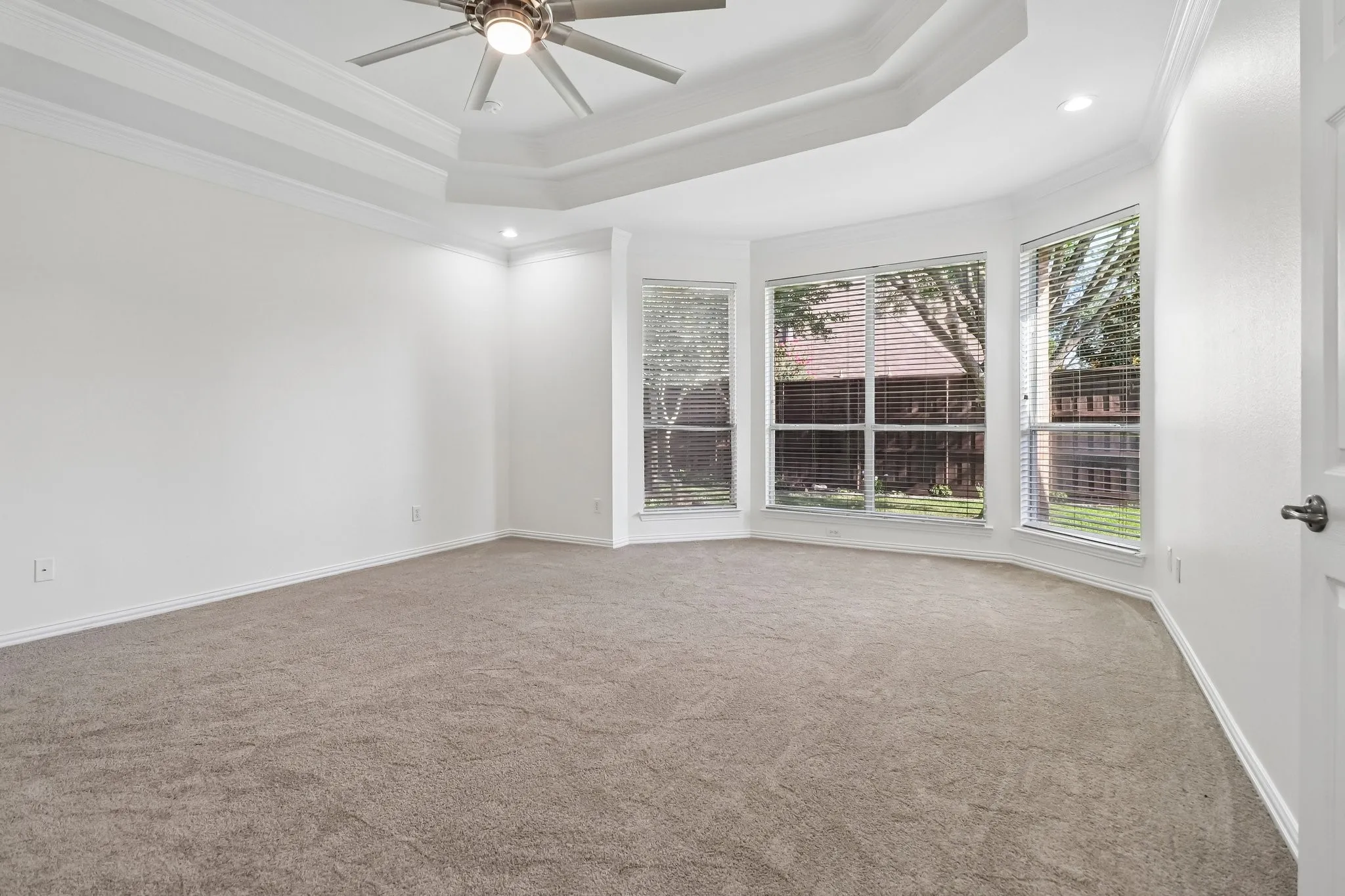 Spacious primary bedroom also has sitting area.