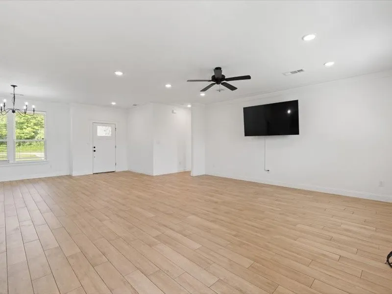 Spacious interior featuring wood-look tile flooring throughout