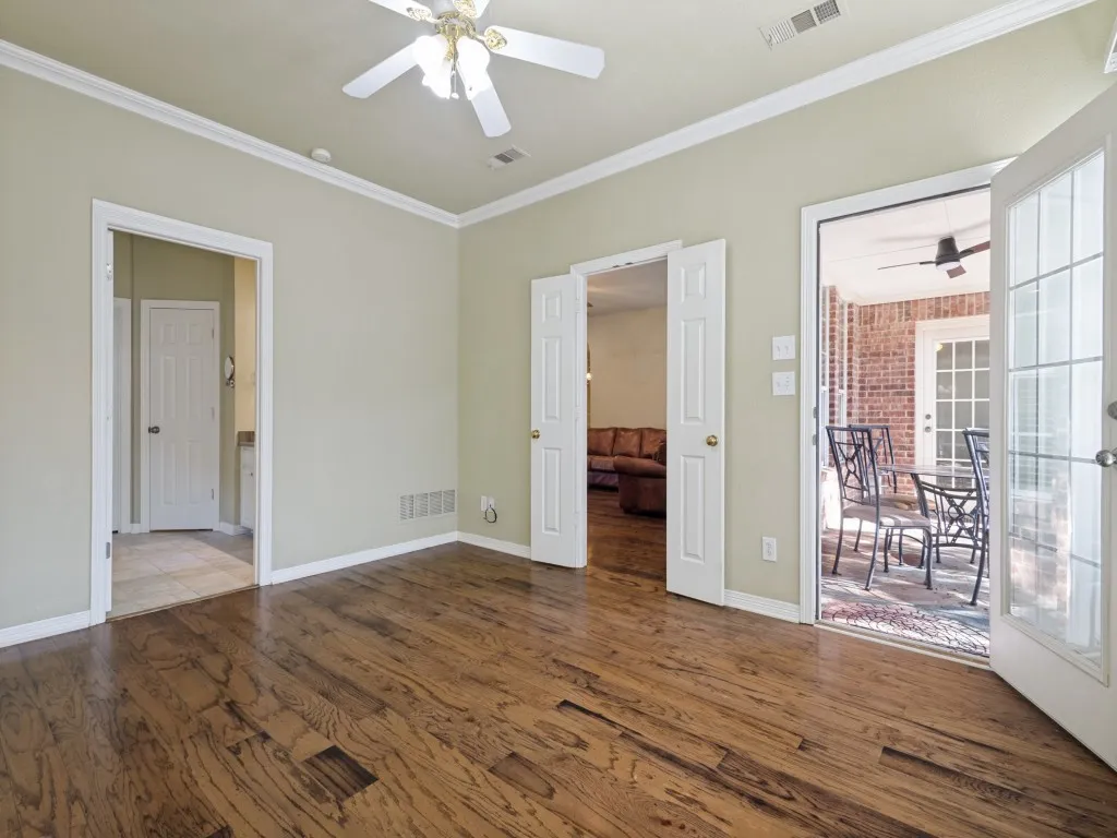 The primary bedroom is located just off the living room and has direct access to the back patio.Double doors lead into the bedroom.