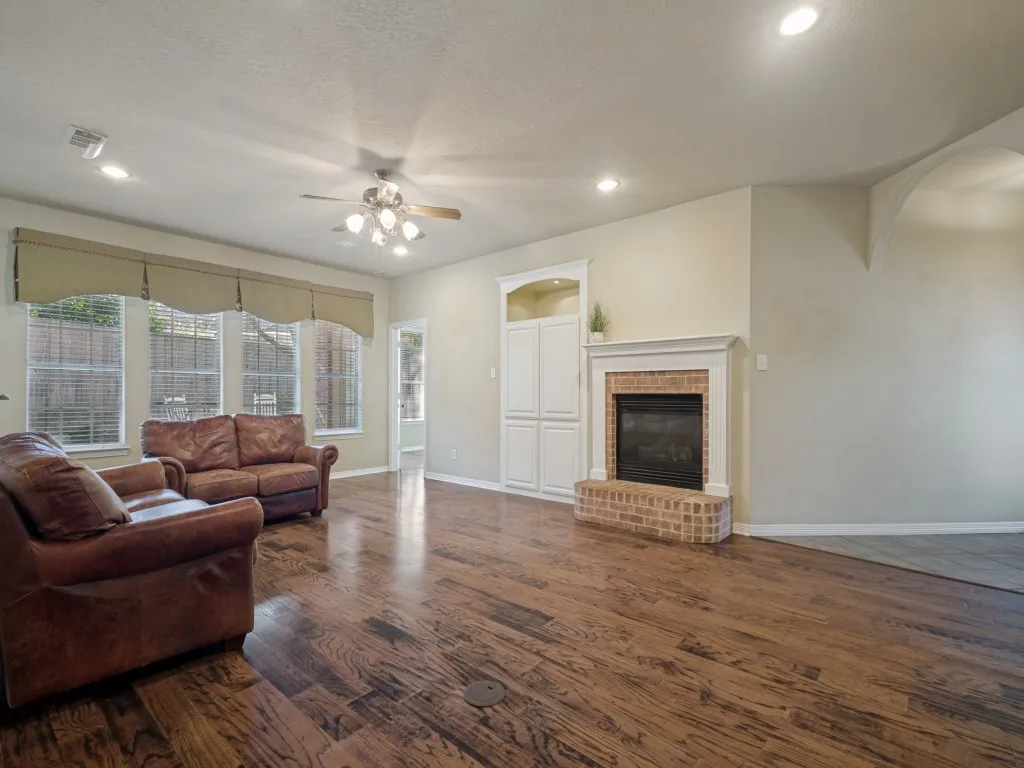 The sealed gas fireplace and built-in entertainment center are the focal point of this large living room. Lots of natural light.