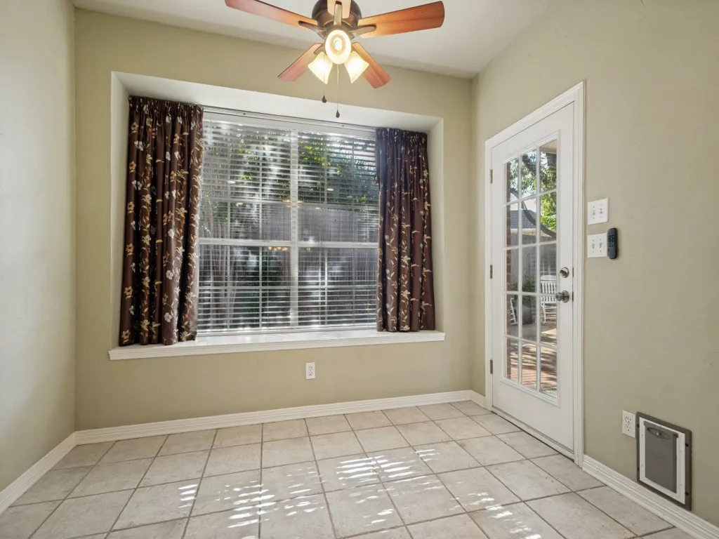 The breakfast nook off the kitchen has a great view of the backyard from the charming window seat.