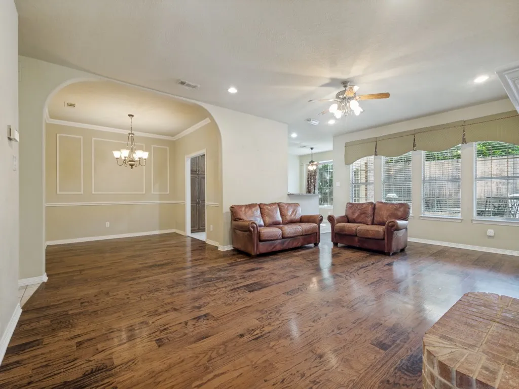 When you step into the home, you are welcomed by the warm wood floors, open space and natural light from the large wall of windows.