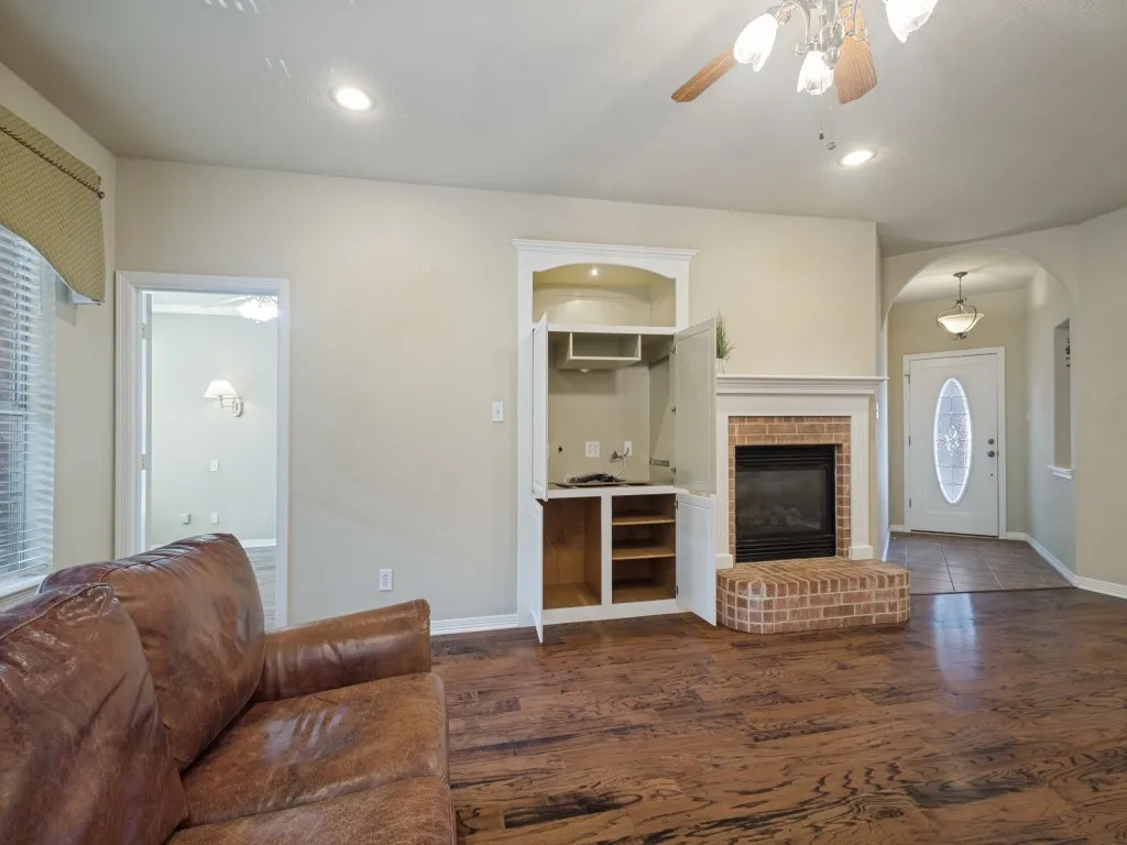  Notice the great storage provided by the built-in entertainment center.  The door to the left leads to the primary bedroom and bathroom.