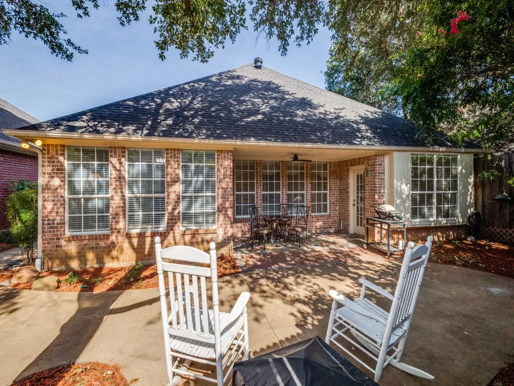 Beautiful backyard. Lots of windows in the home make it light and bright.  Doorway to the right leads into the breakfast nook.