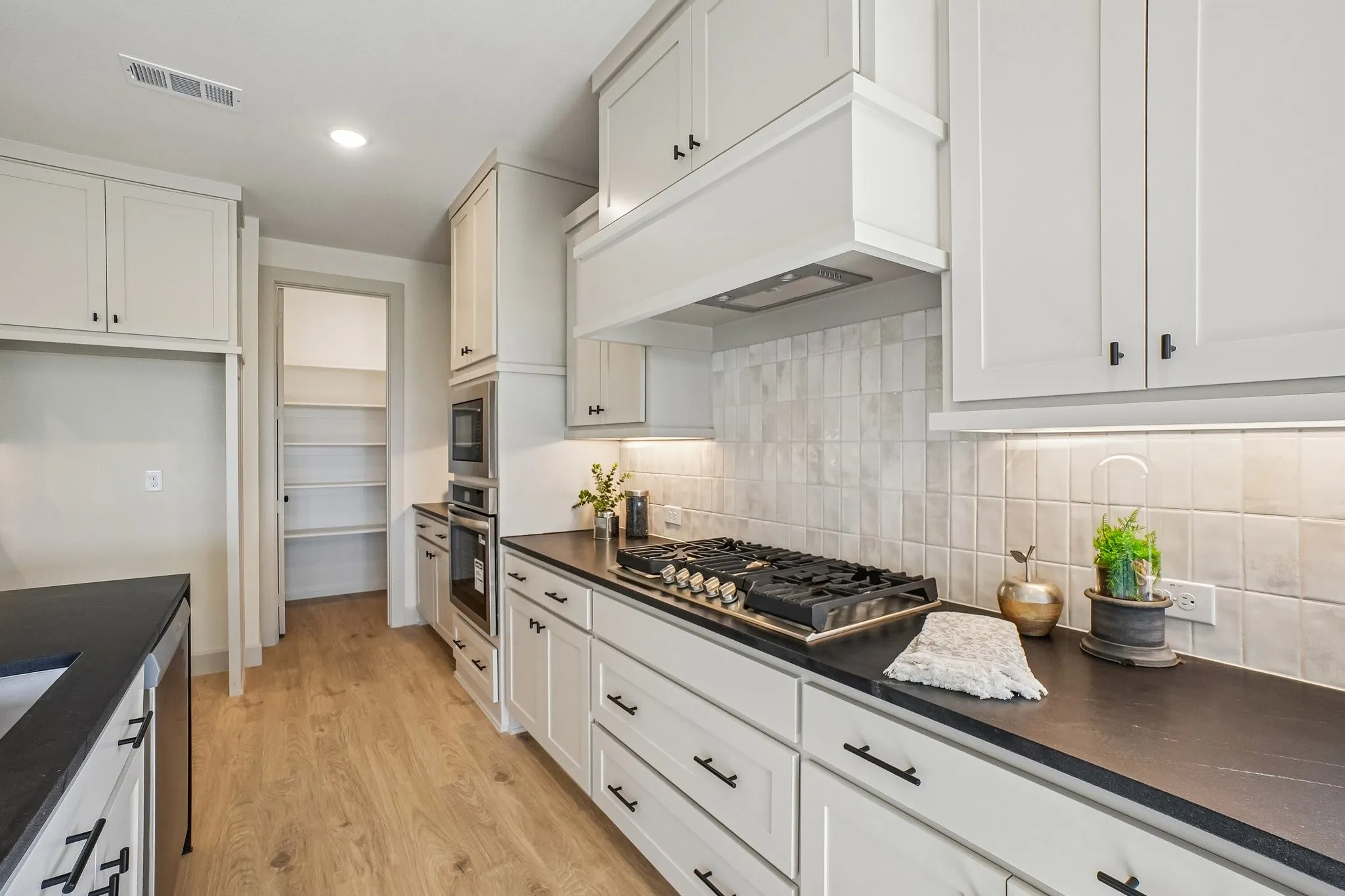 Beautiful cabinetry, stainless appliances and gorgeous flooring combine to make this dream kitchen a reality!
