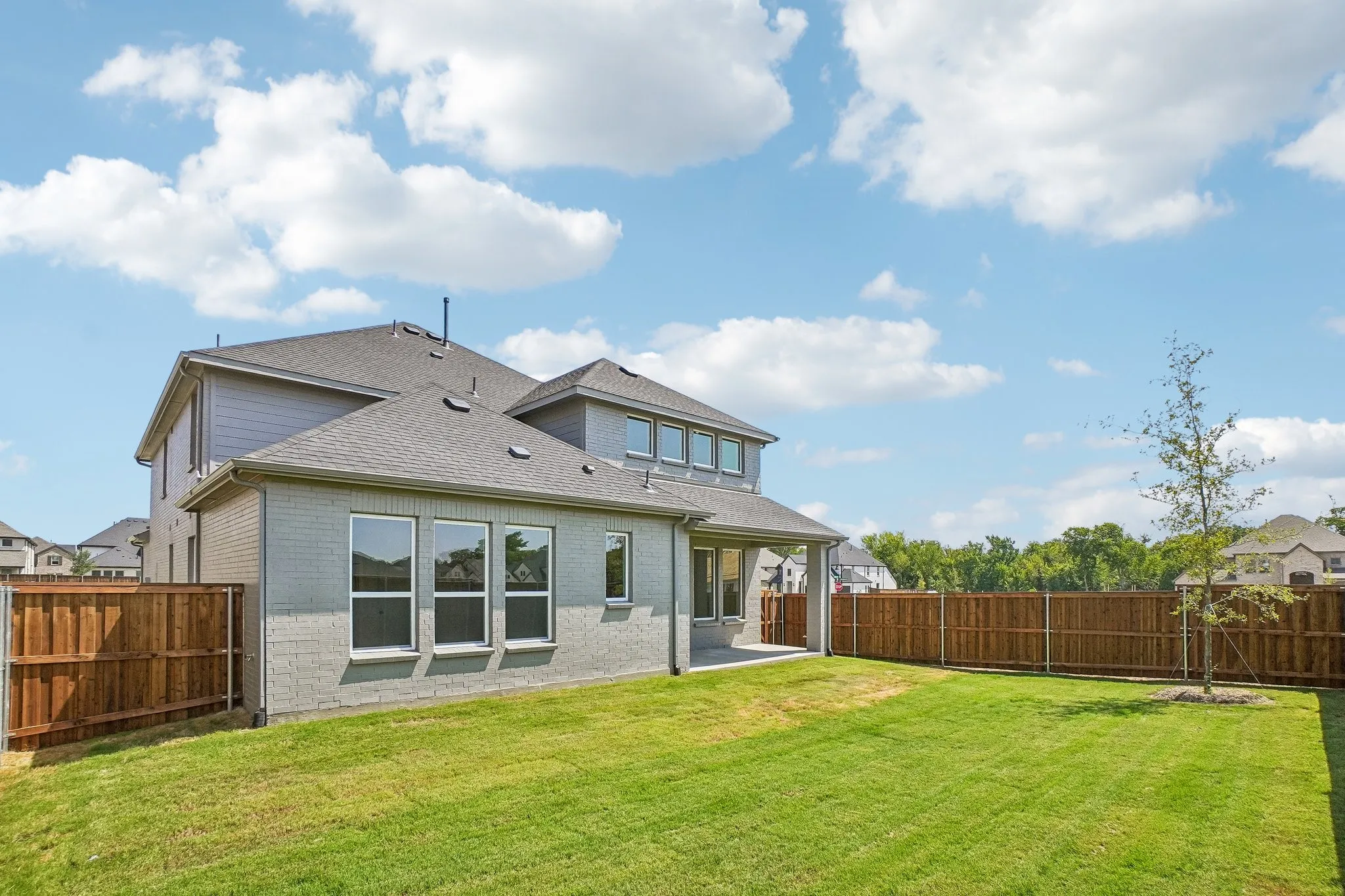 Plenty of summertime fun to be had by the entire family in this private, fenced back yard!