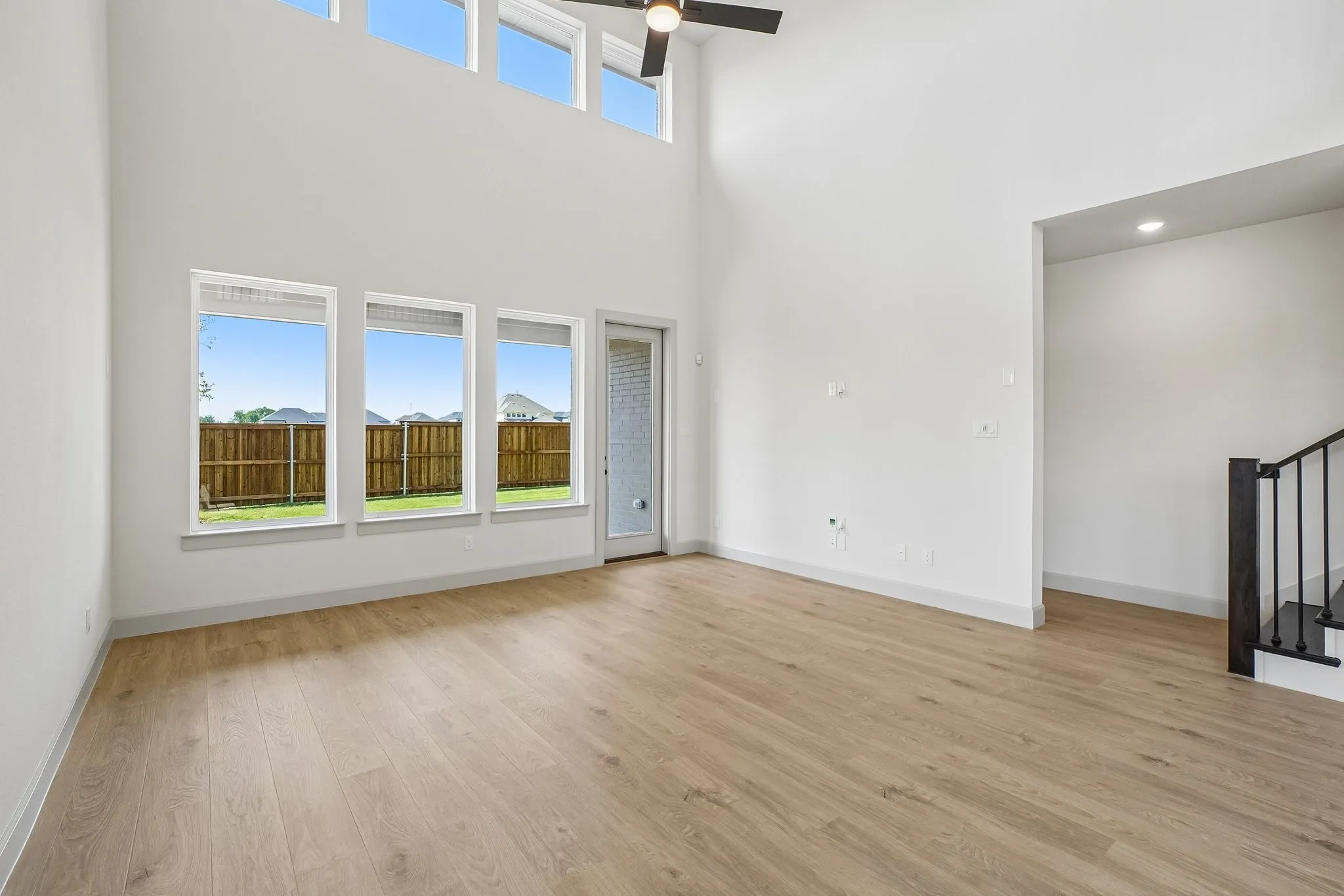 Your new family room is flooded with natural light from floor to ceiling windows!