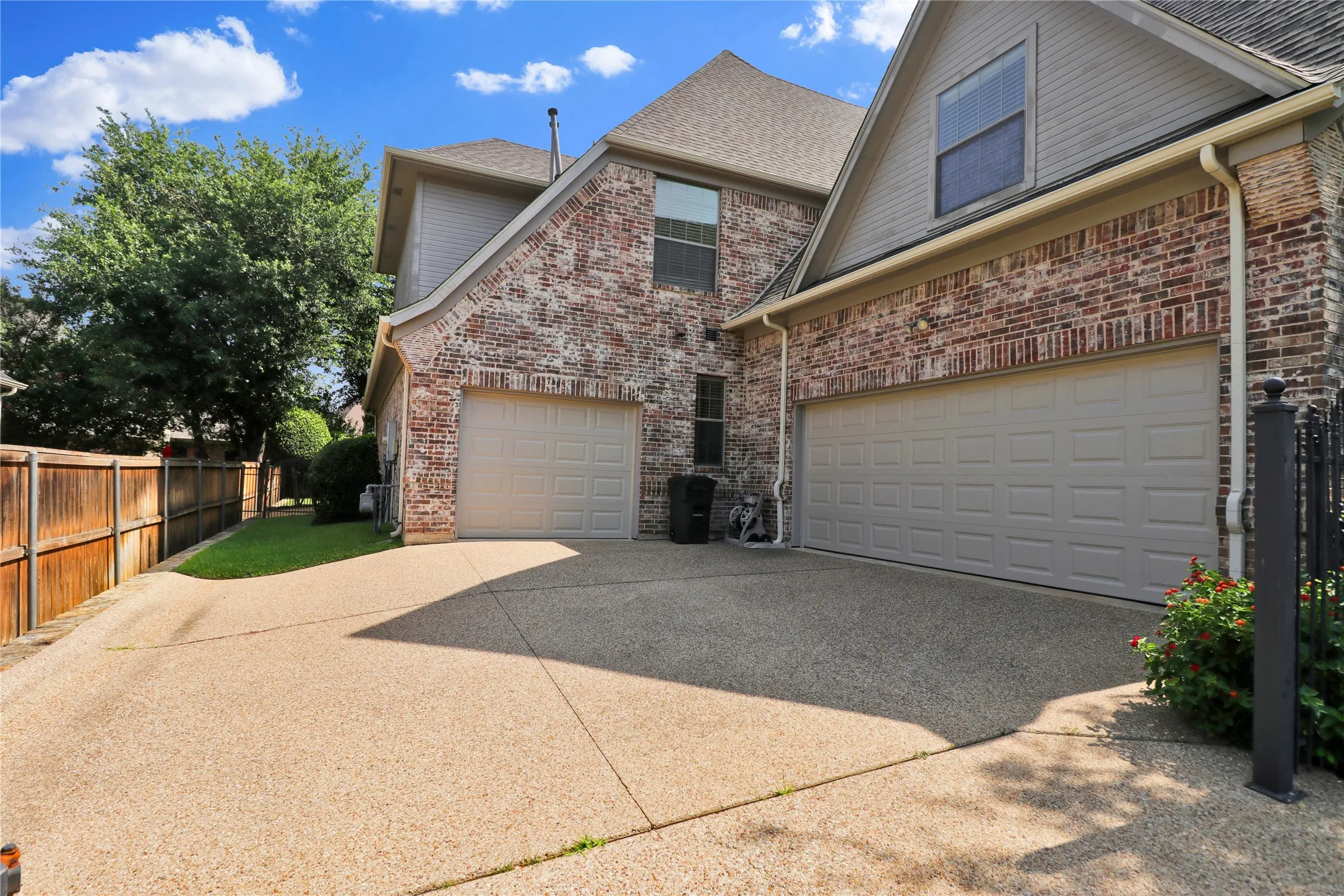 2 car garage plus a 3rd garage. 3rd car garage entry is right by the mother in law suite downstairs.