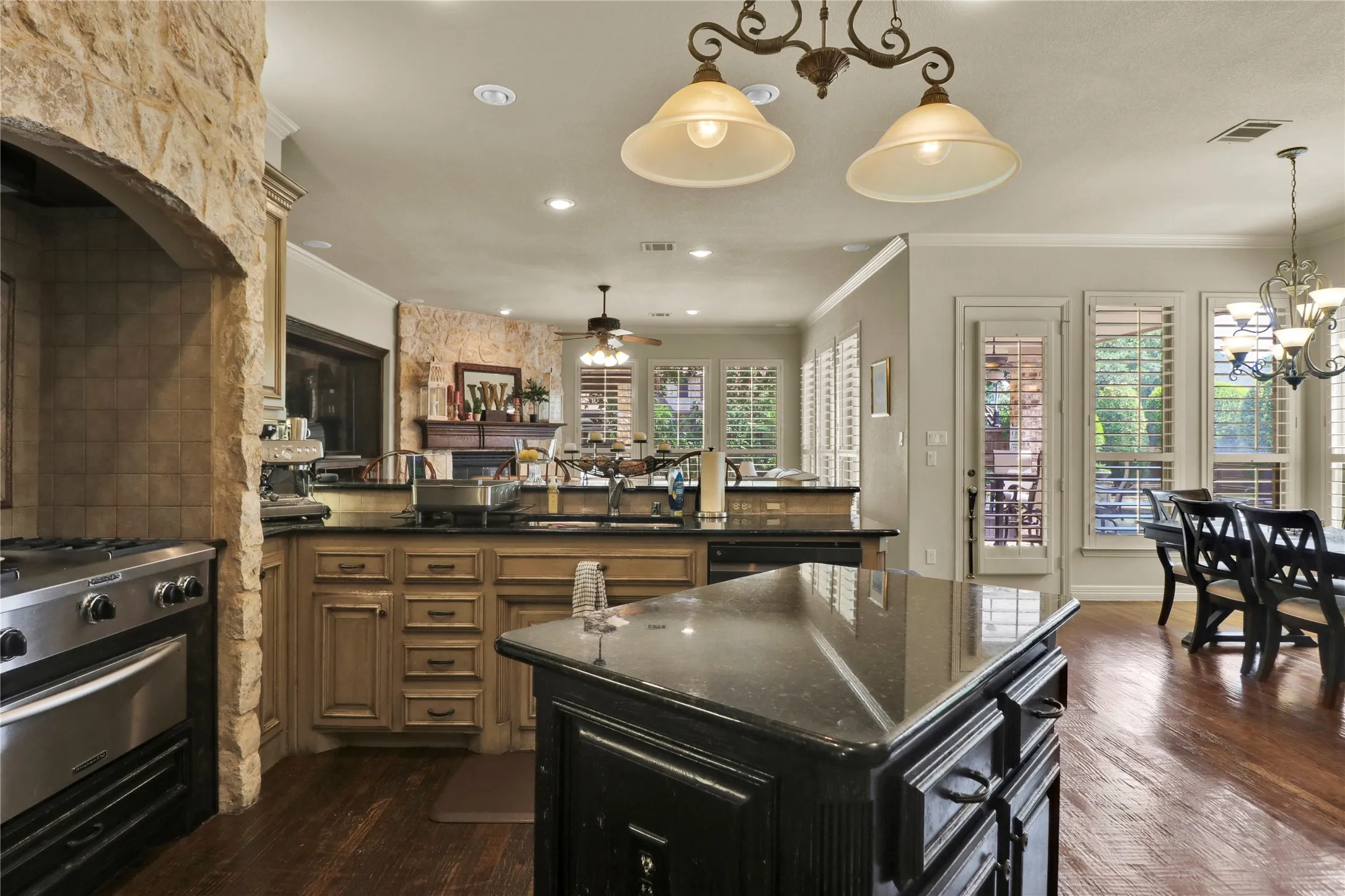 View of living room and breakfast area from kitchen. Open and spacious with wonderful natural light.