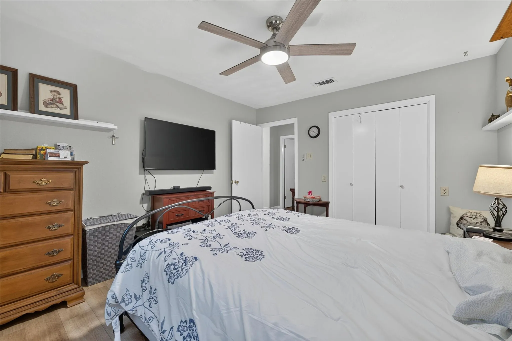 Light gray walls with wood-finish flooring