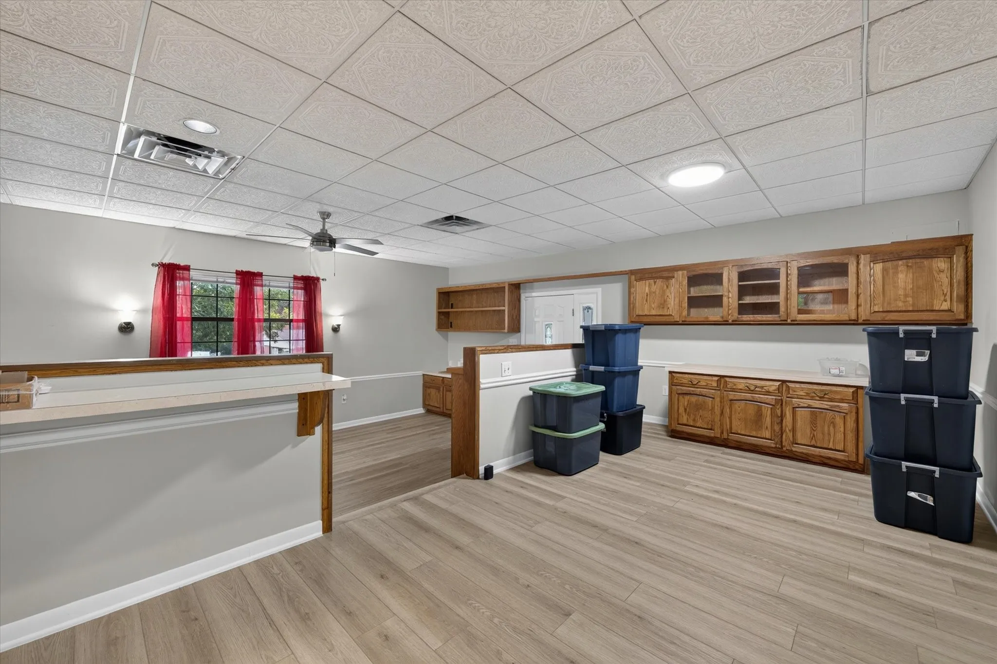 Dining area that overlooks den with multiple built in cabinets for storage
