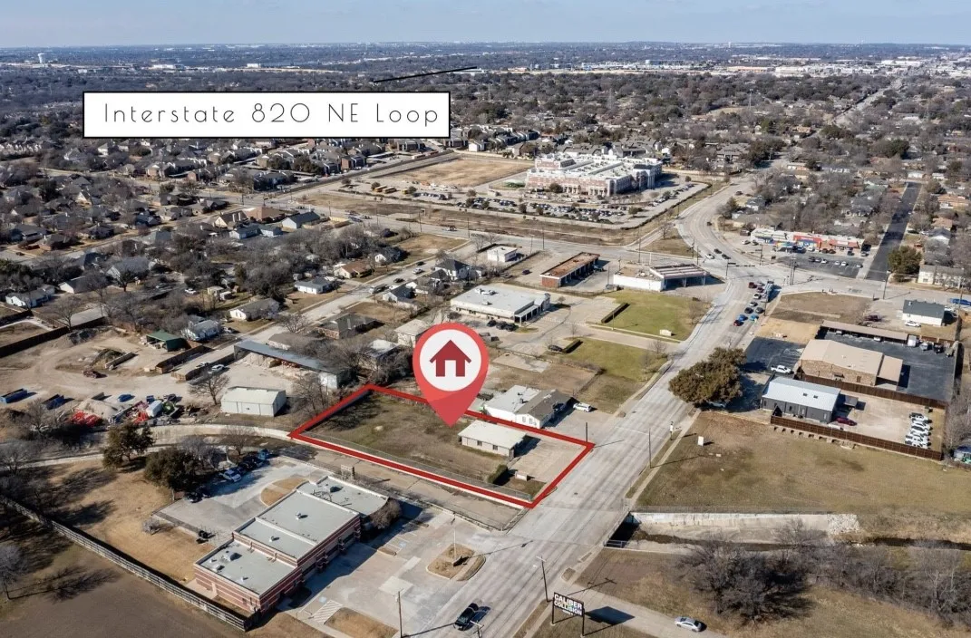 Aerial perspective showcasing a property with significant road frontage