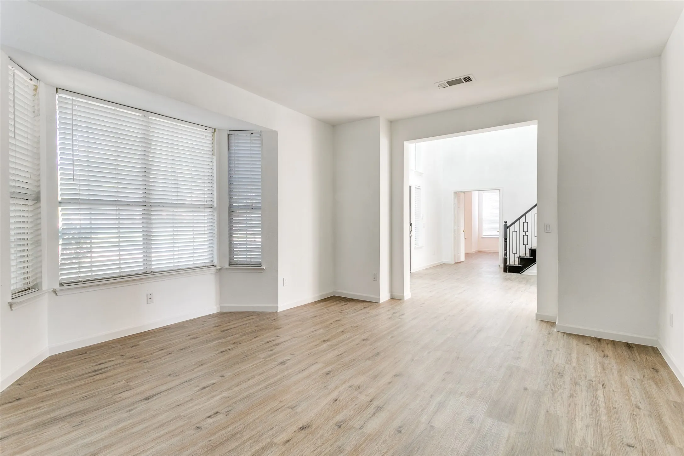 Spare room with light hardwood / wood-style floors