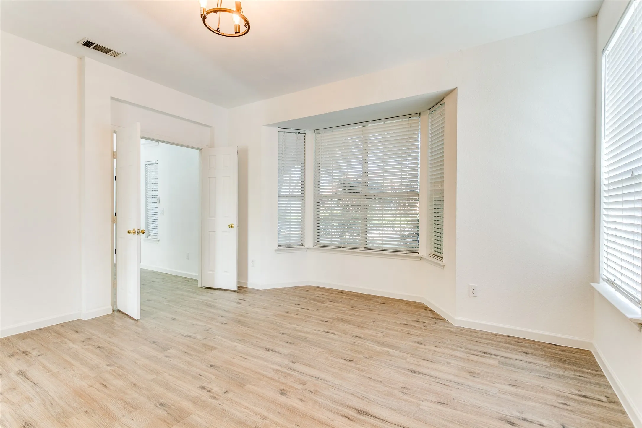 Spare room featuring light hardwood / wood-style flooring