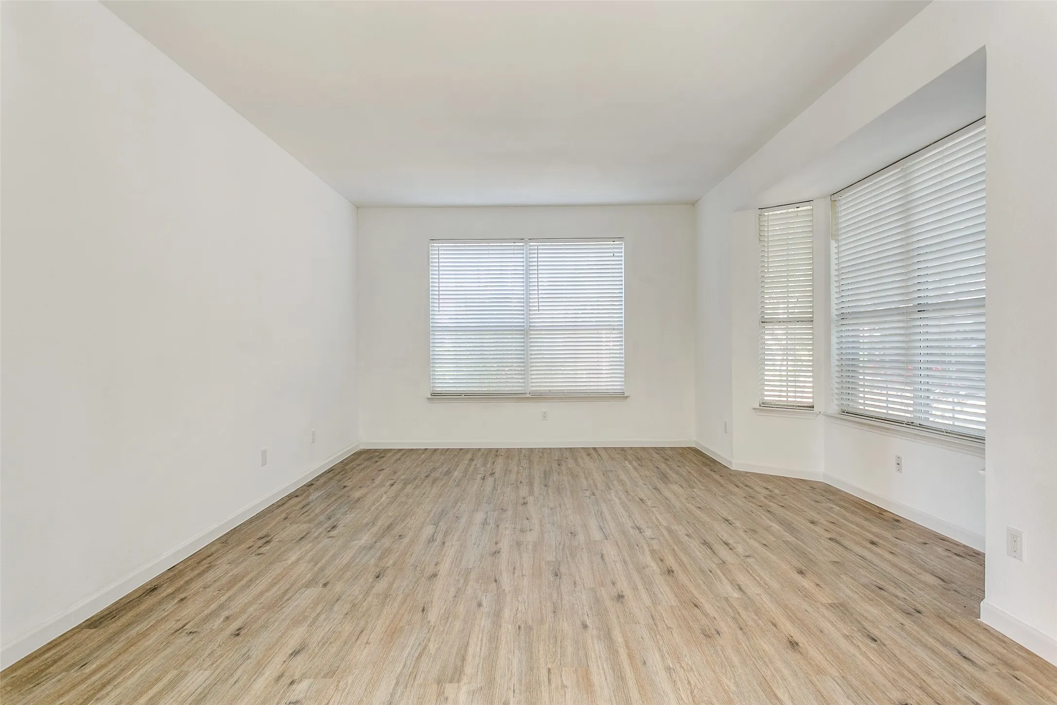 Spare room featuring light wood-type flooring