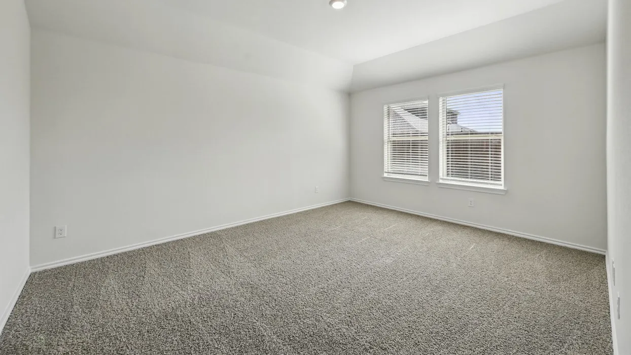 Neutral toned carpeting complemented by white walls and trim