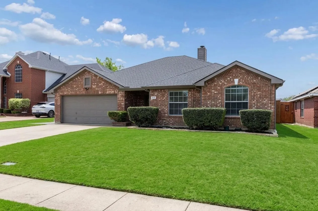 Single story brick Royse City home with driveway parking.