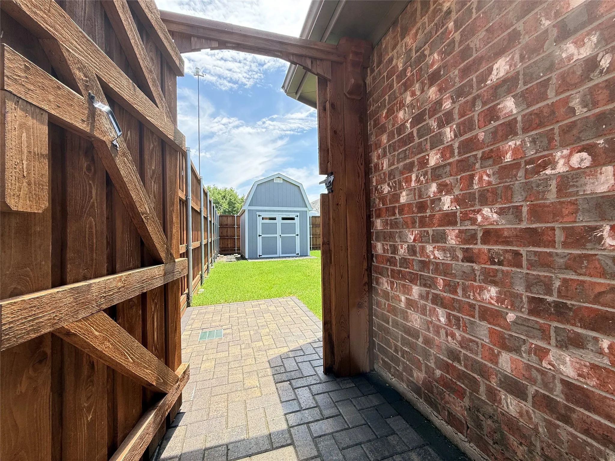 Improved side yard access connects the exterior spaces and supports easier backyard use and maintenance.