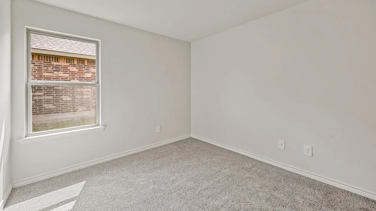 Neutral color palette with light gray carpeting and white baseboards