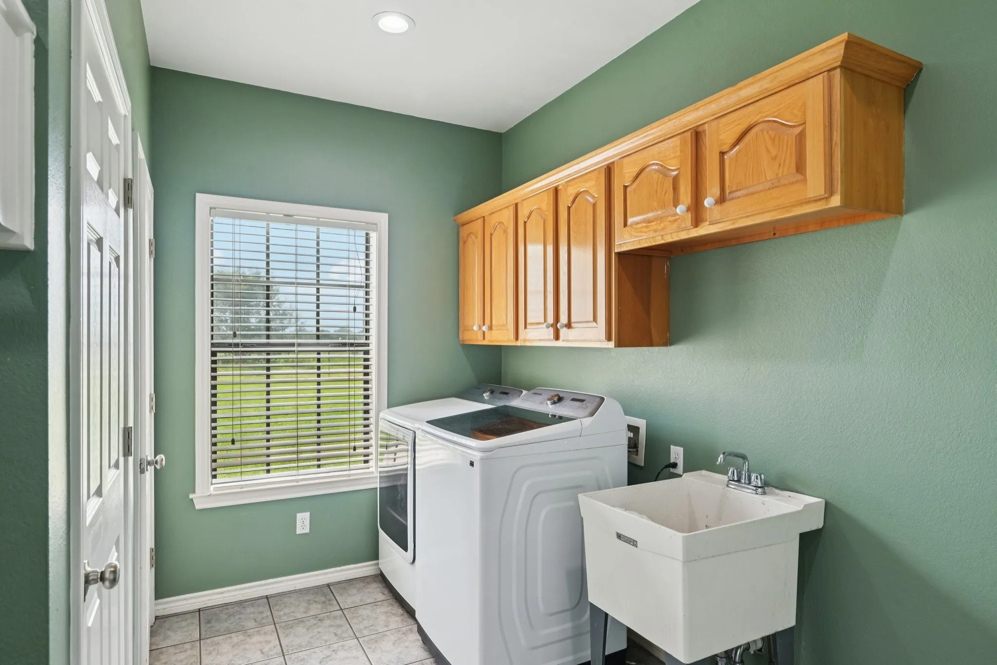 Large Landry Room with Utility Sink and Storage