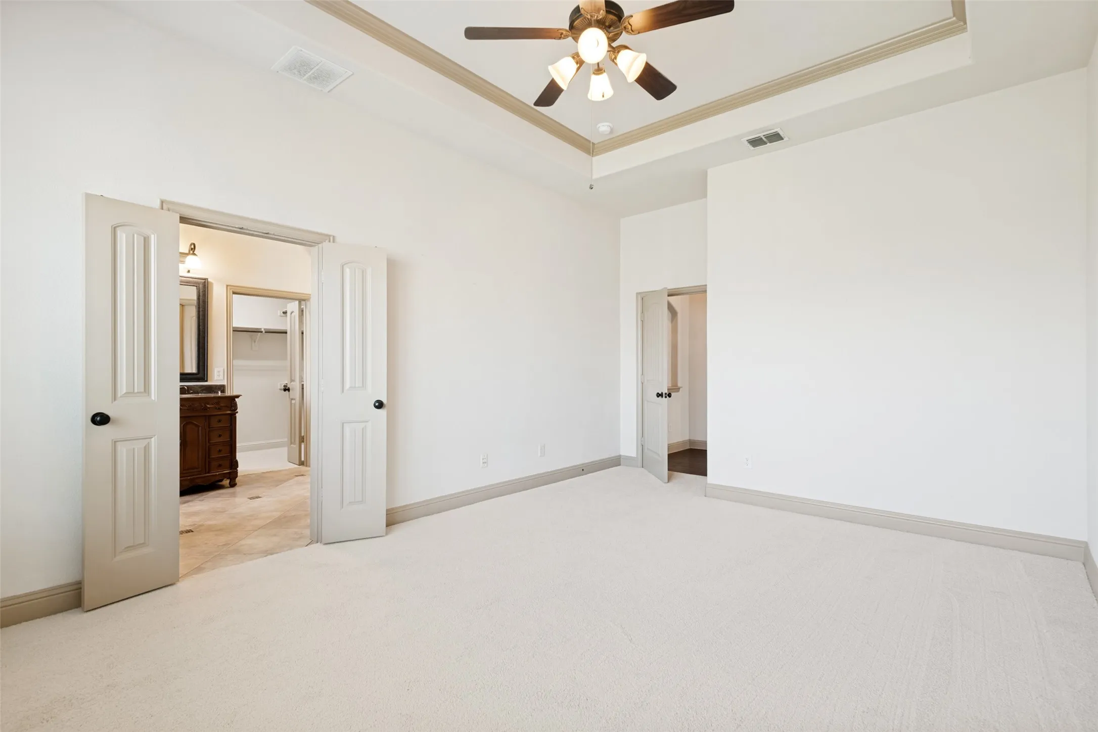 Split bedrooms offer privacy as well as new carpet.