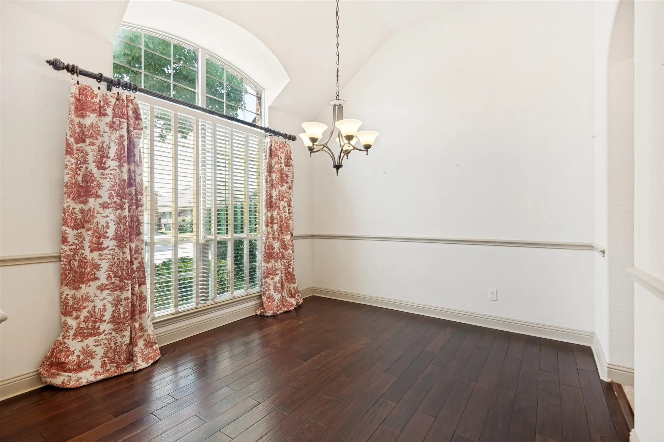 Entertain in this roomy Dining with Hardwoods.