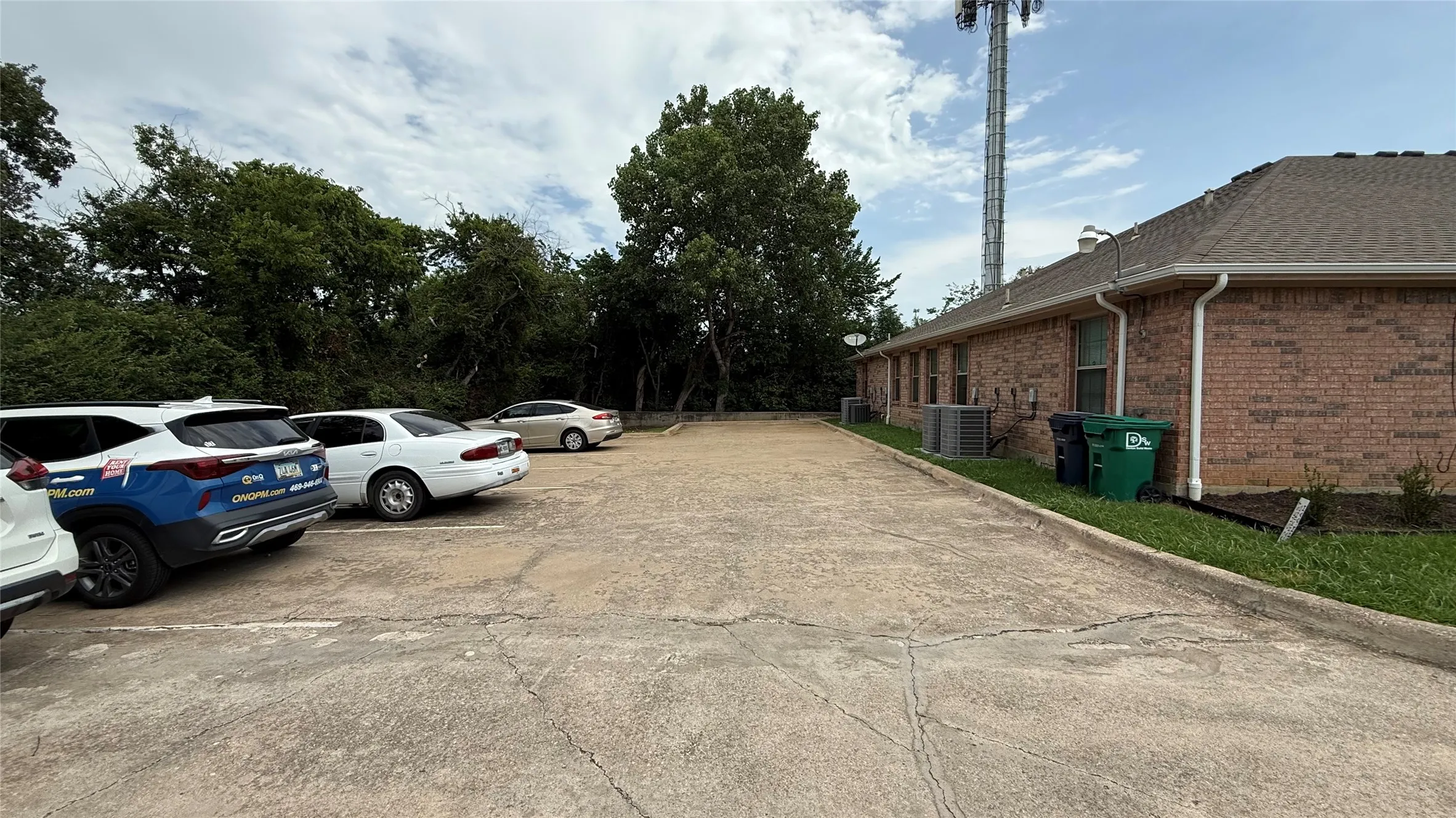 Extensive concrete parking area with ample space