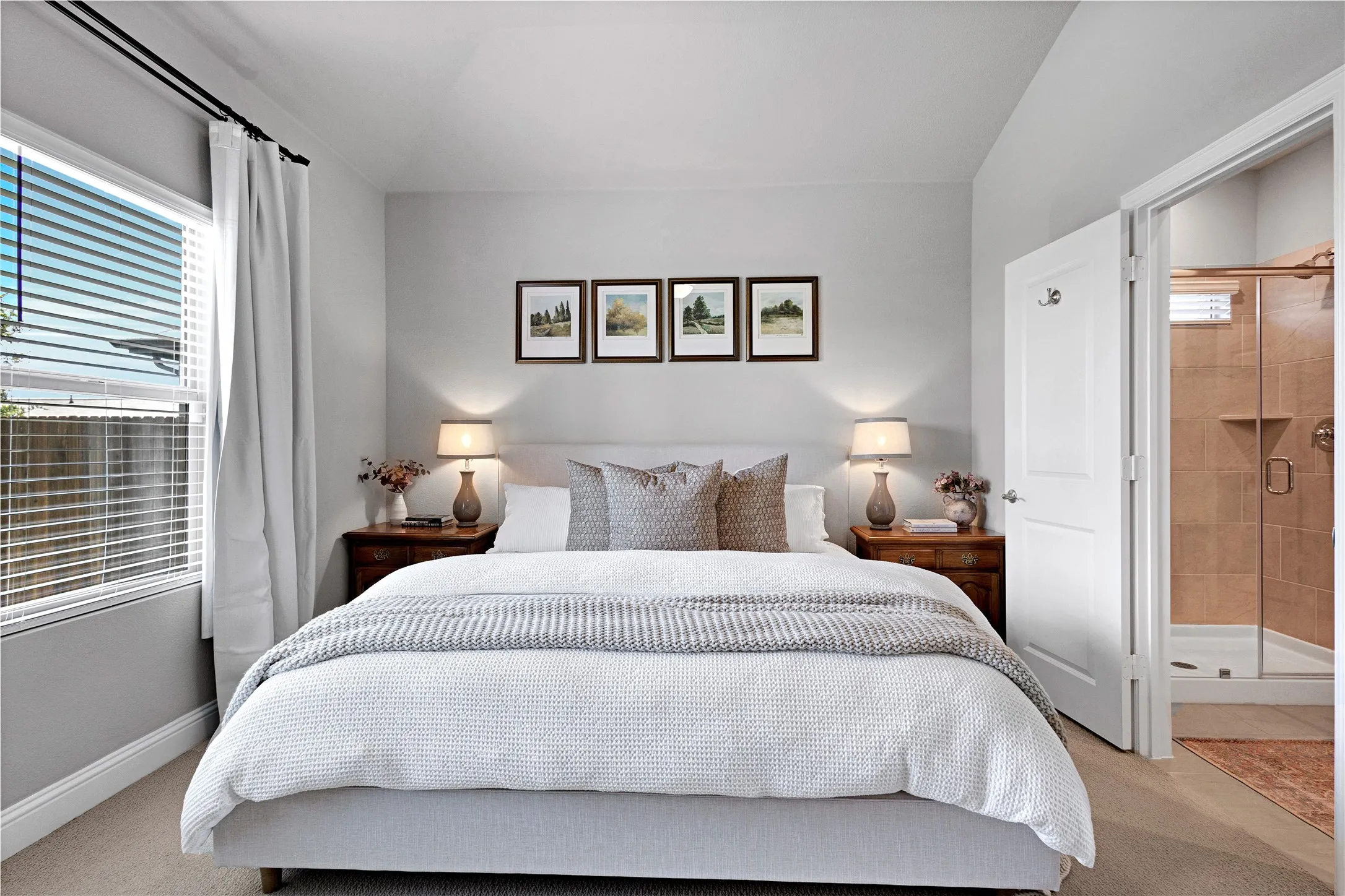 Primary Bedroom with ensuite bath, ceiling fan and upgraded carpet.