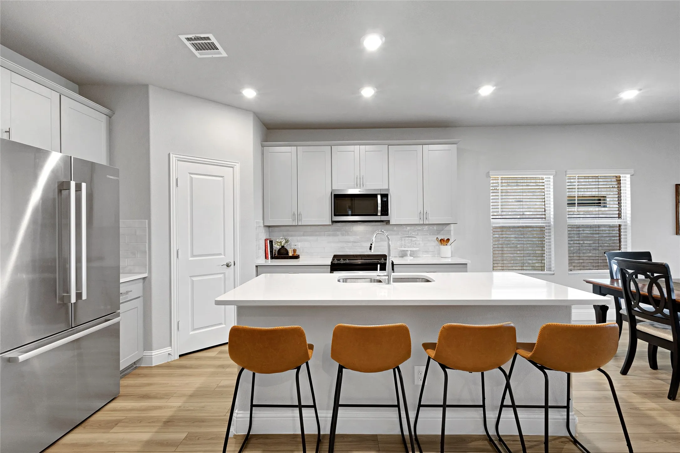 Breakfast bar with quartz countertops.