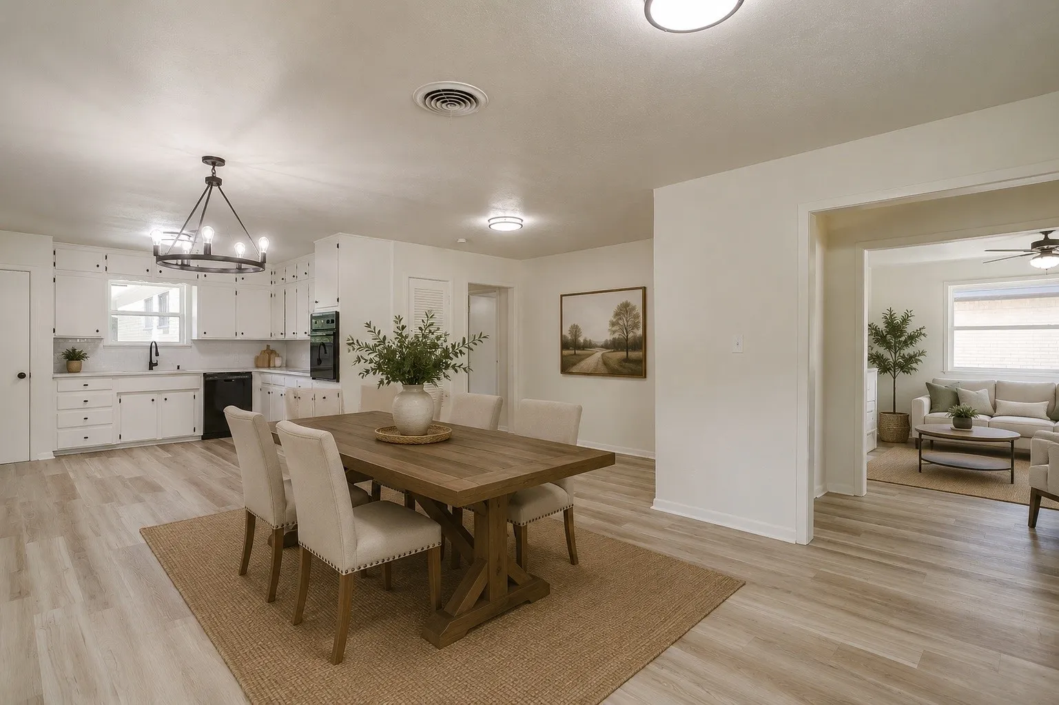 Dining area with wood-finish flooring and a contemporary chandelier. * Photo virtually staged using AI.