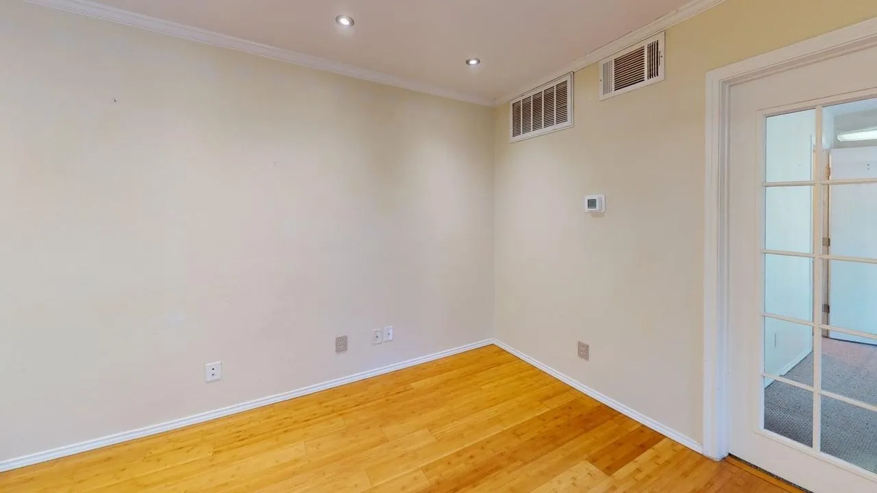 Room featuring light wood-finish flooring, recessed ceiling lighting, and crown molding