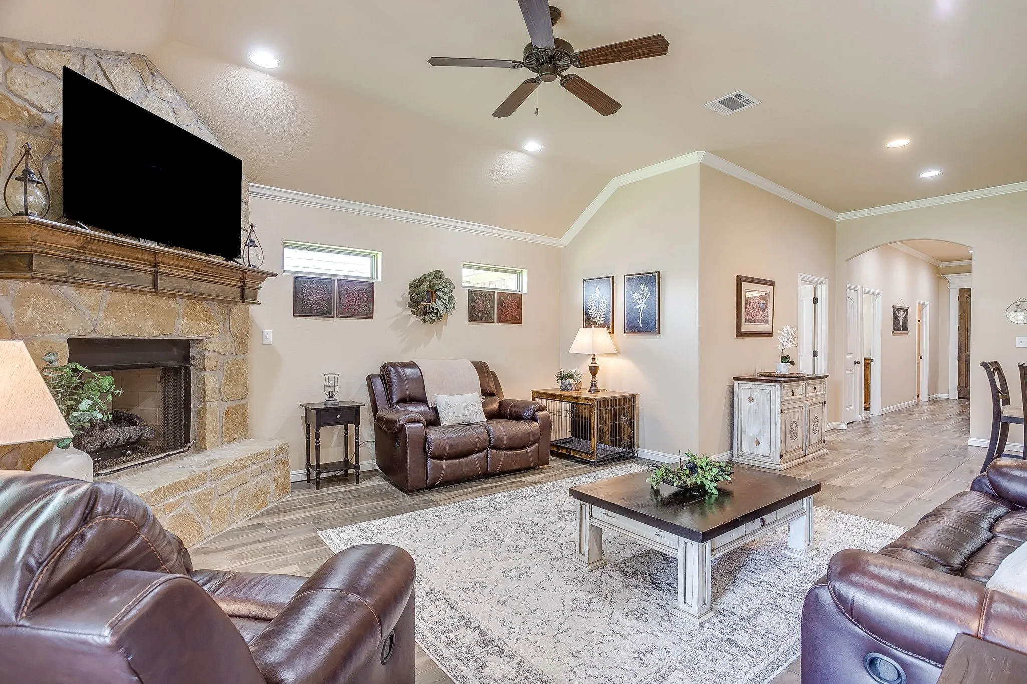 Stone fireplace with a substantial wood mantel