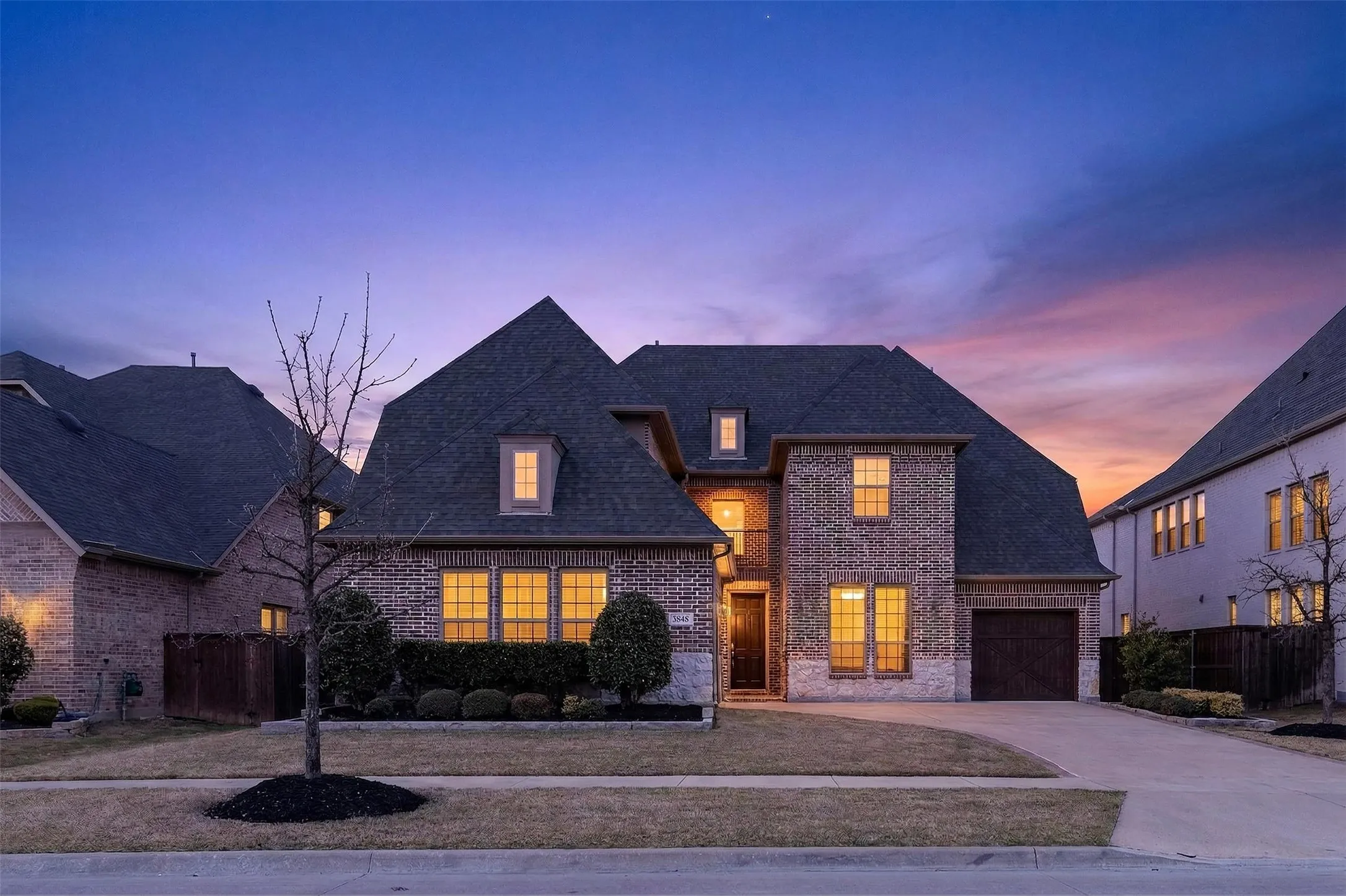 Brick and stone exterior with a multi-gabled roofline